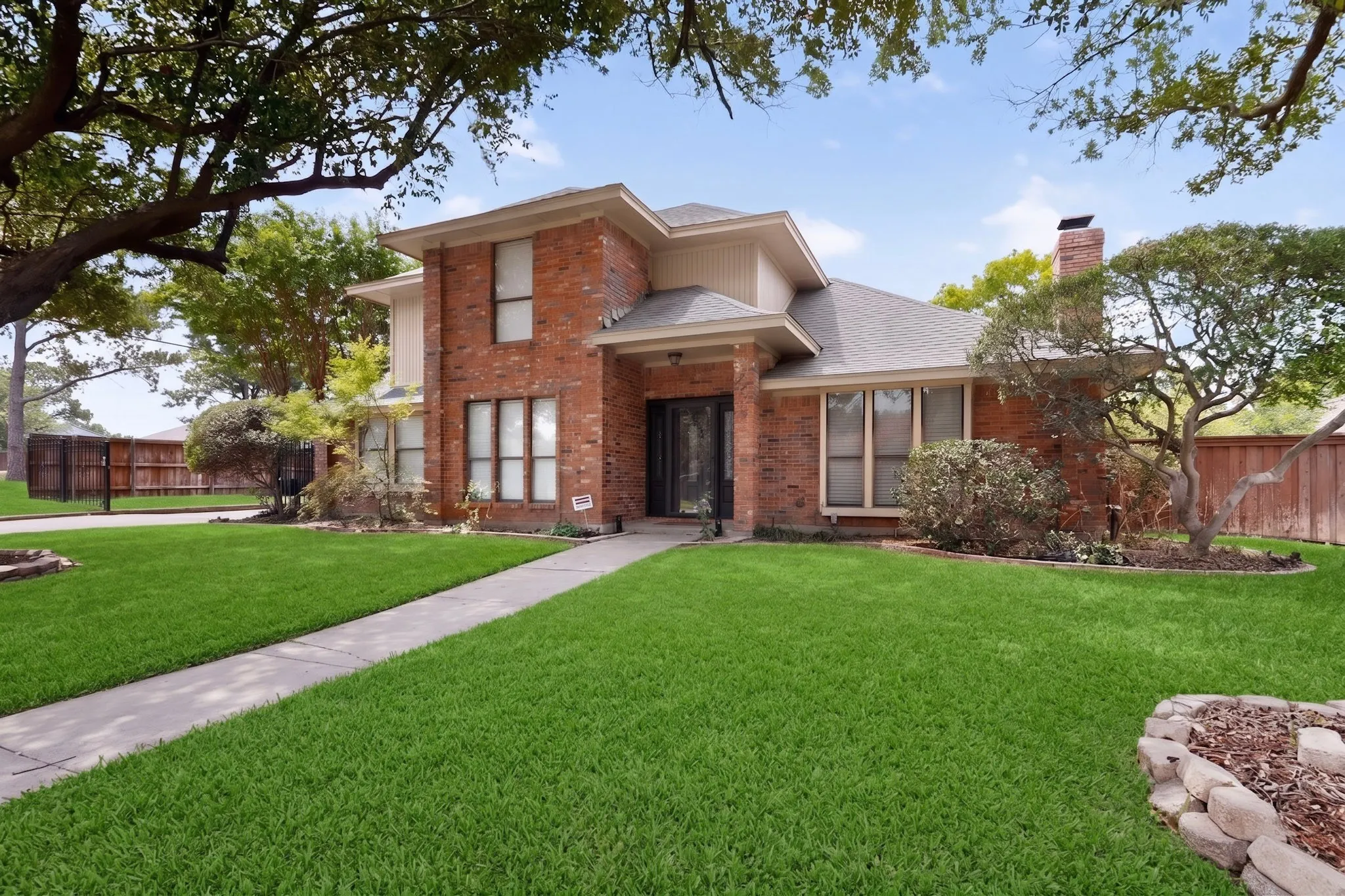 Brick facade residence with a prominent chimney