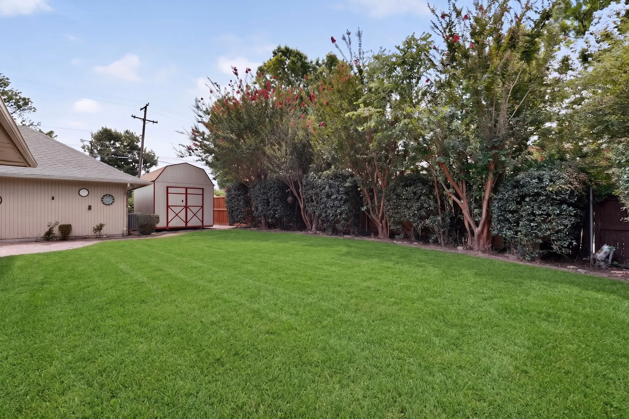 Expansive green lawn providing abundant outdoor space