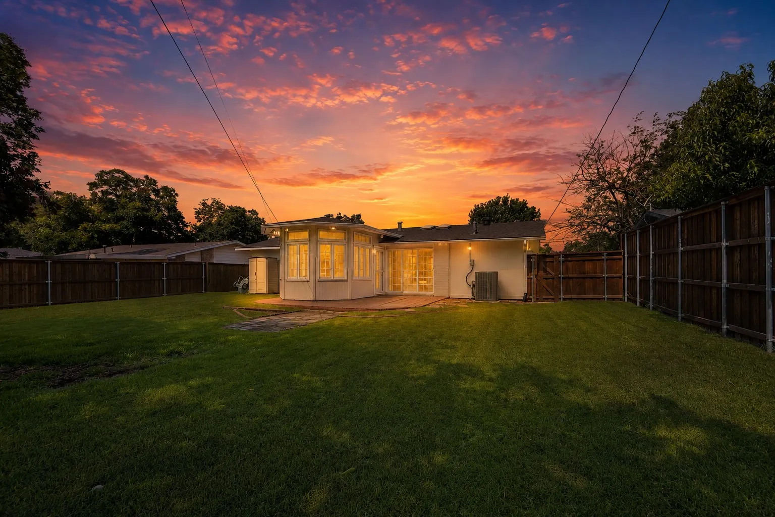 Expansive lawn with perimeter fencing