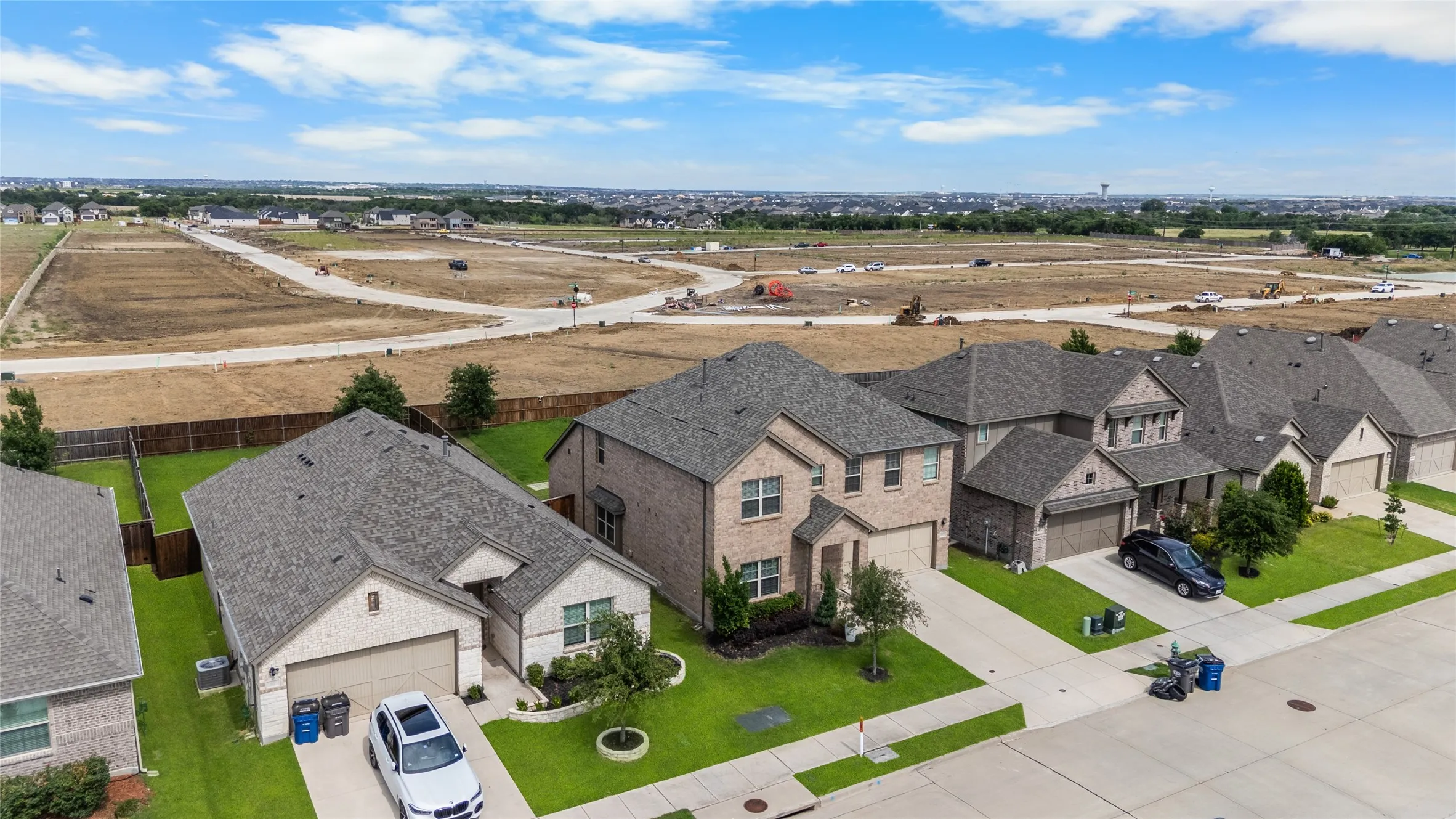 Modern residential neighborhood with uniform rooflines and brick exteriors