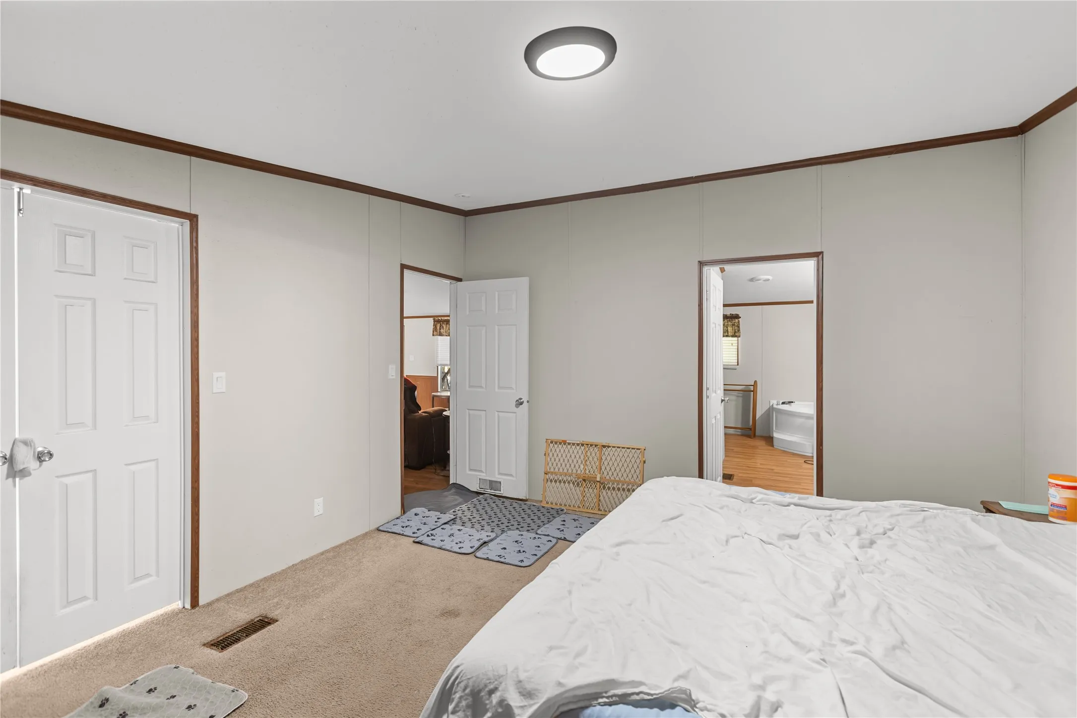 Neutral wall tones with contrasting dark wood-finish trim