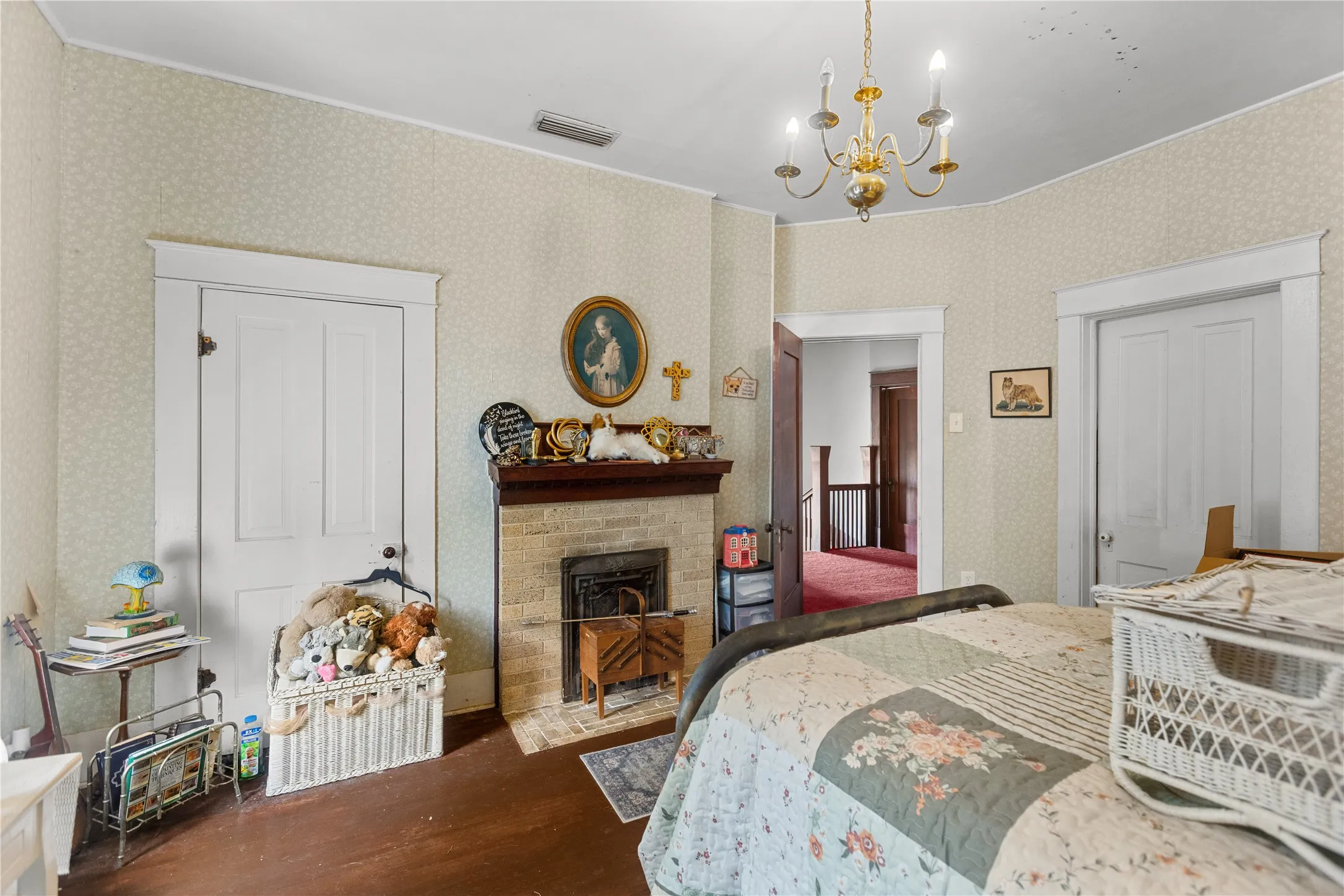 Traditional fireplace with brick surround and wood mantle