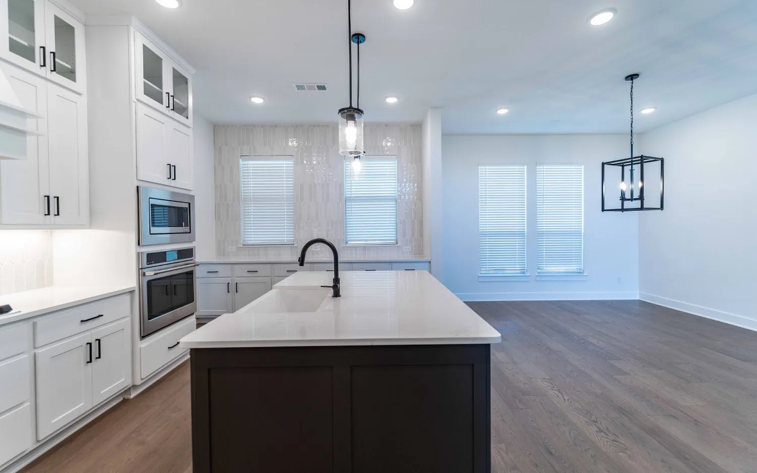 Kitchen island with a white countertop and integrated sink