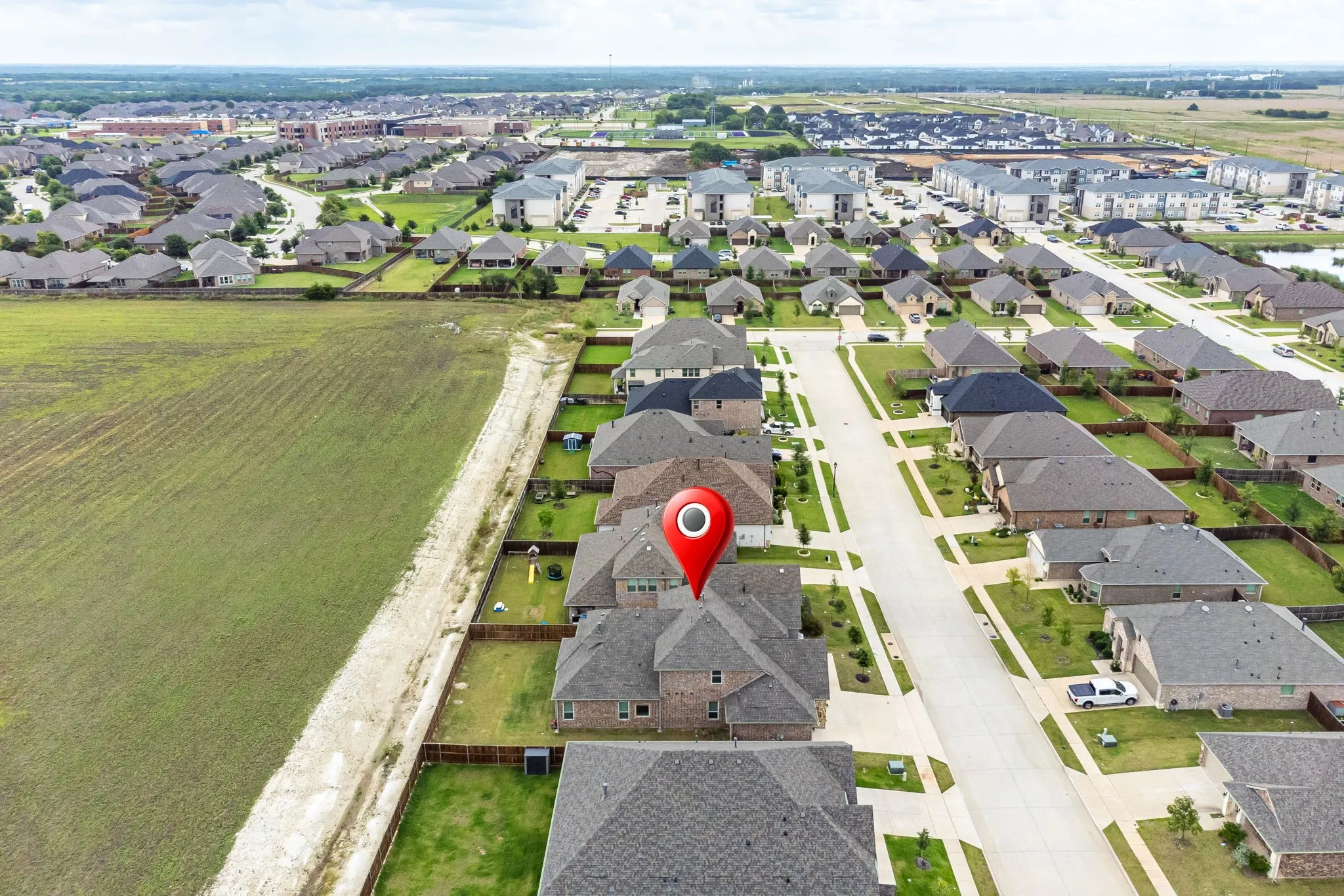 Aerial perspective showcasing a residential neighborhood with a variety of single-family homes and multi-family buildings