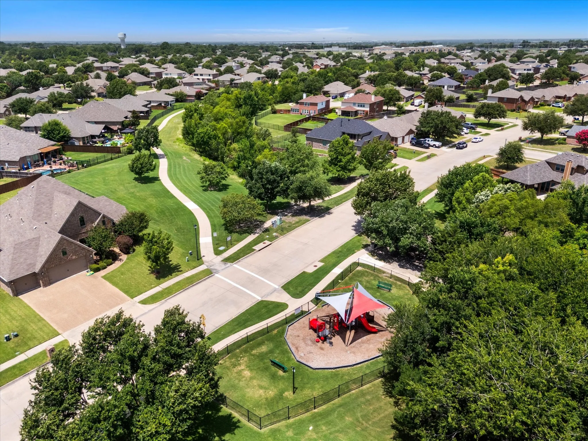 Aerial perspective showcasing a residential community with abundant green spaces