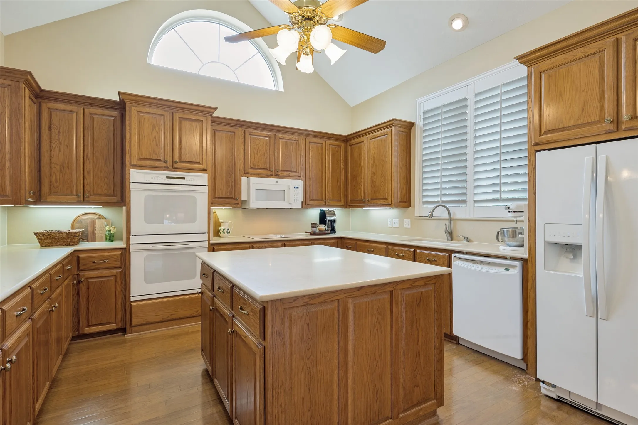 Kitchen featuring double oven, microwave, refrigerator and dishwasher