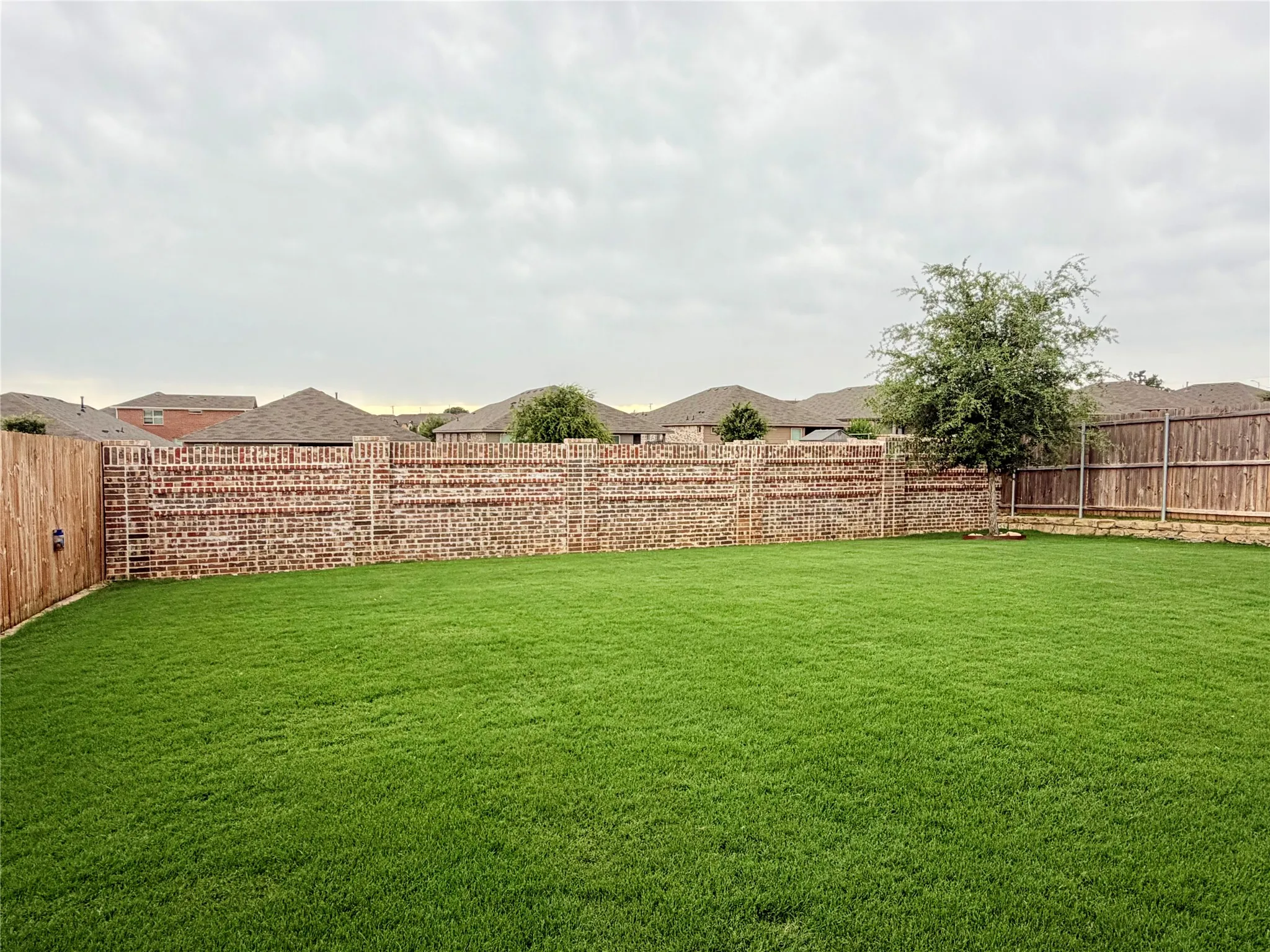Gorgeous brick fence along the back