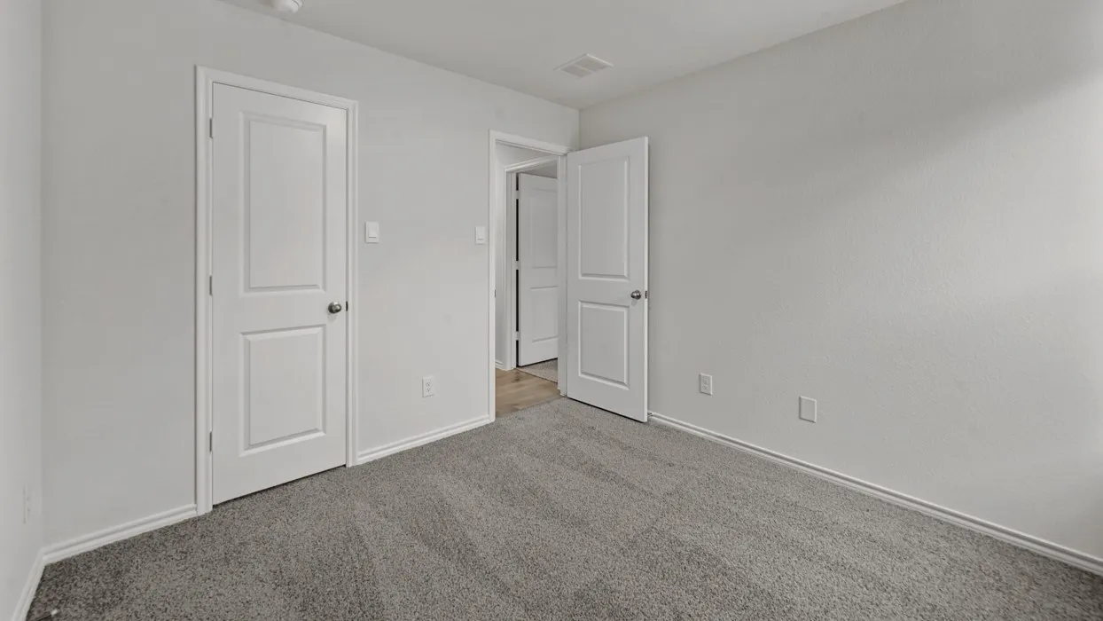 Light gray textured carpet and white painted walls