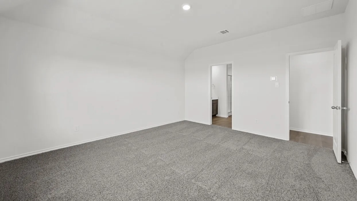 Carpeted room featuring light gray walls, a recessed ceiling light, and white baseboards