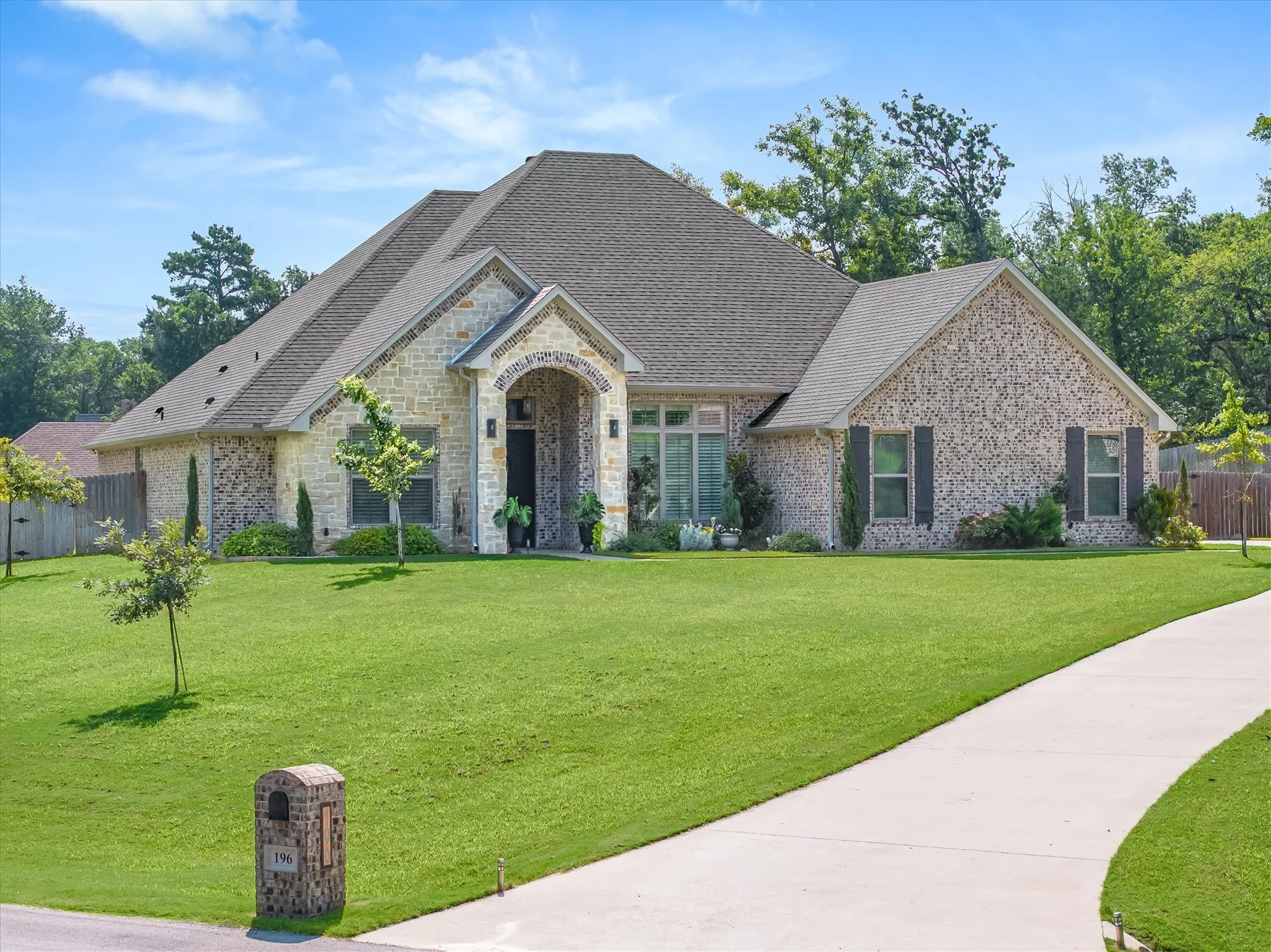 Long driveway leading up to a side 2 car garage