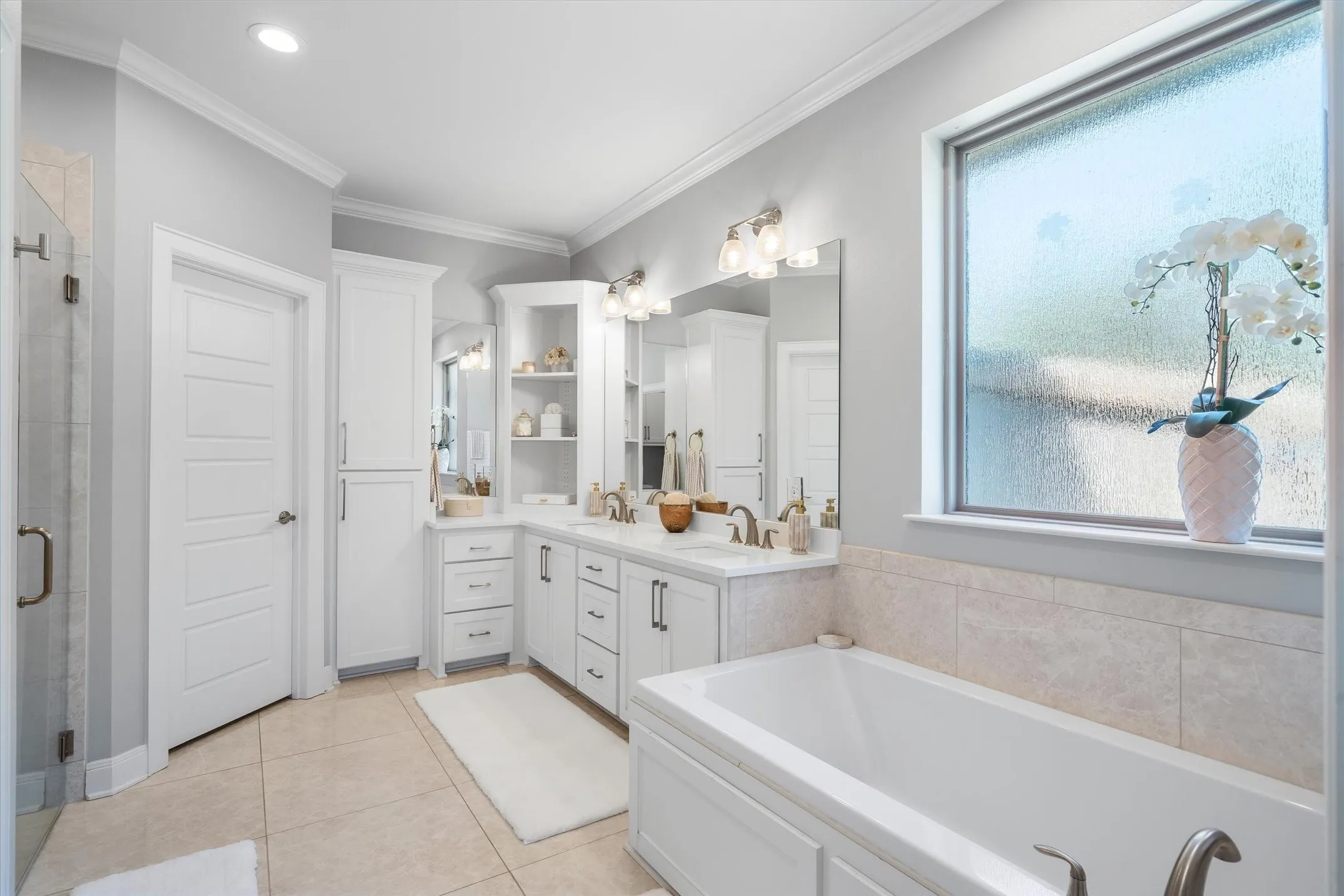 Soaker tub, dual sinks and walk in tiled shower
