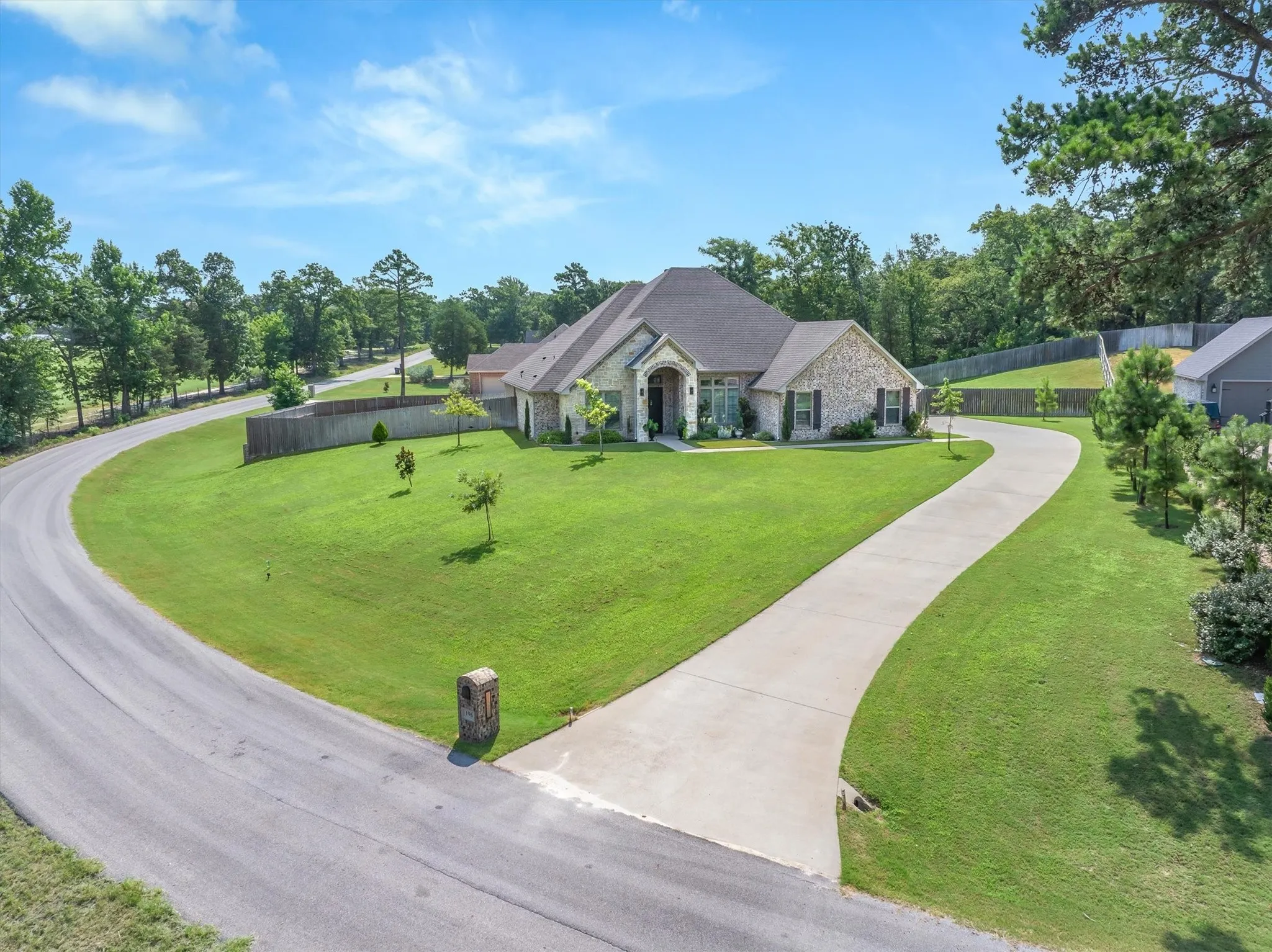 Perched on a slight hill, with golf course quality yard this home is definitely eye catching!