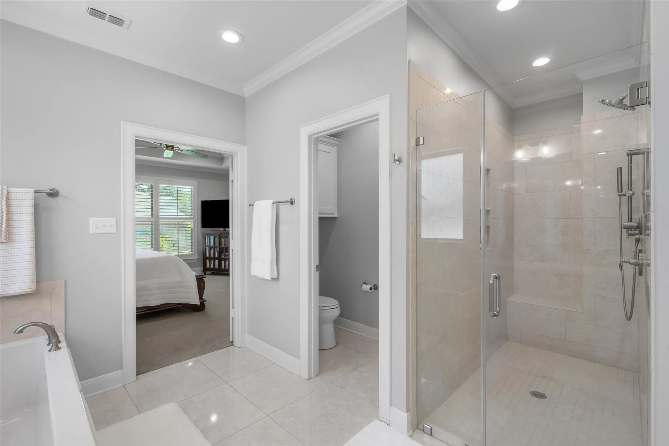 Walk in tile shower with seating area