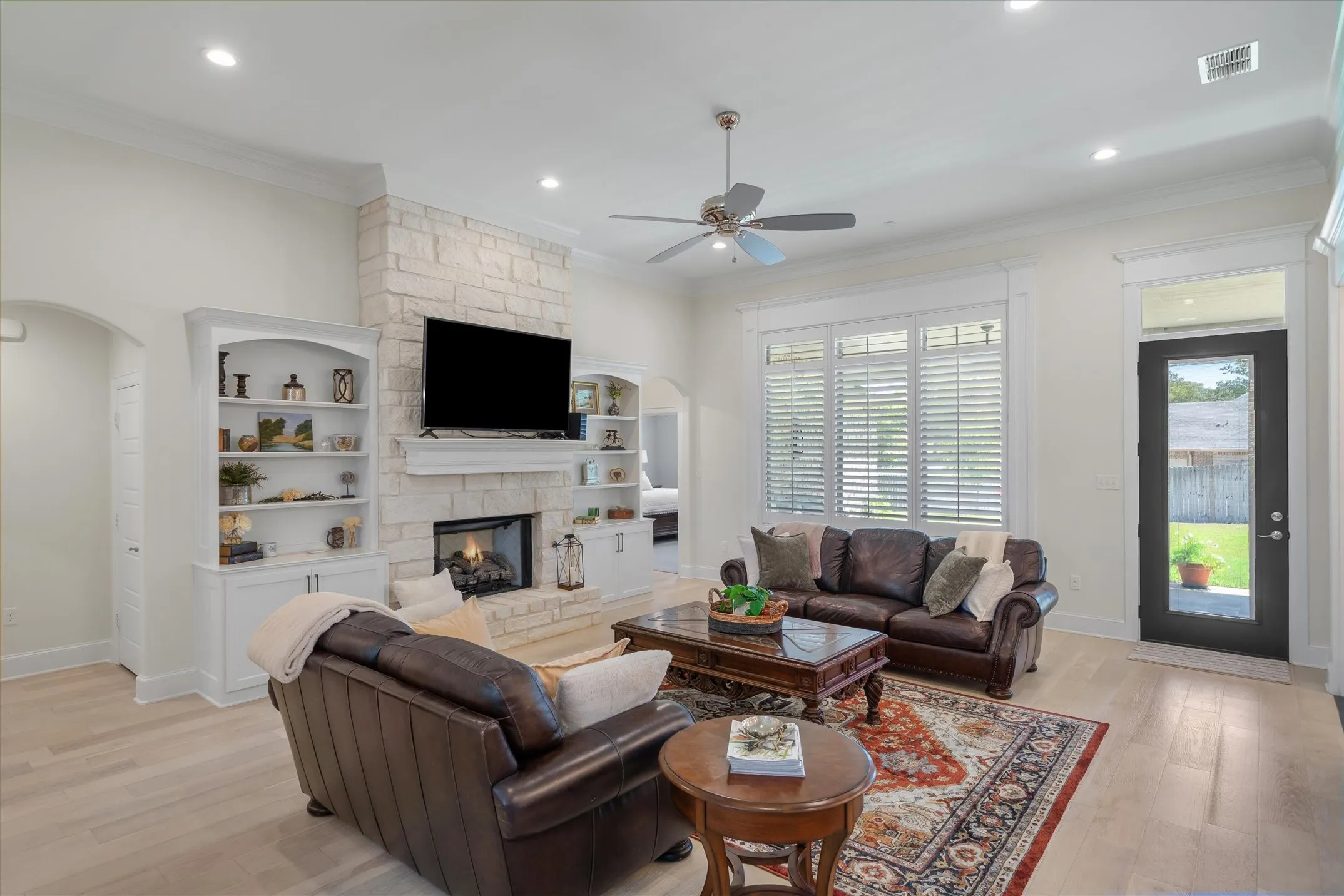 Just off the living room is the transom door to the covered patio