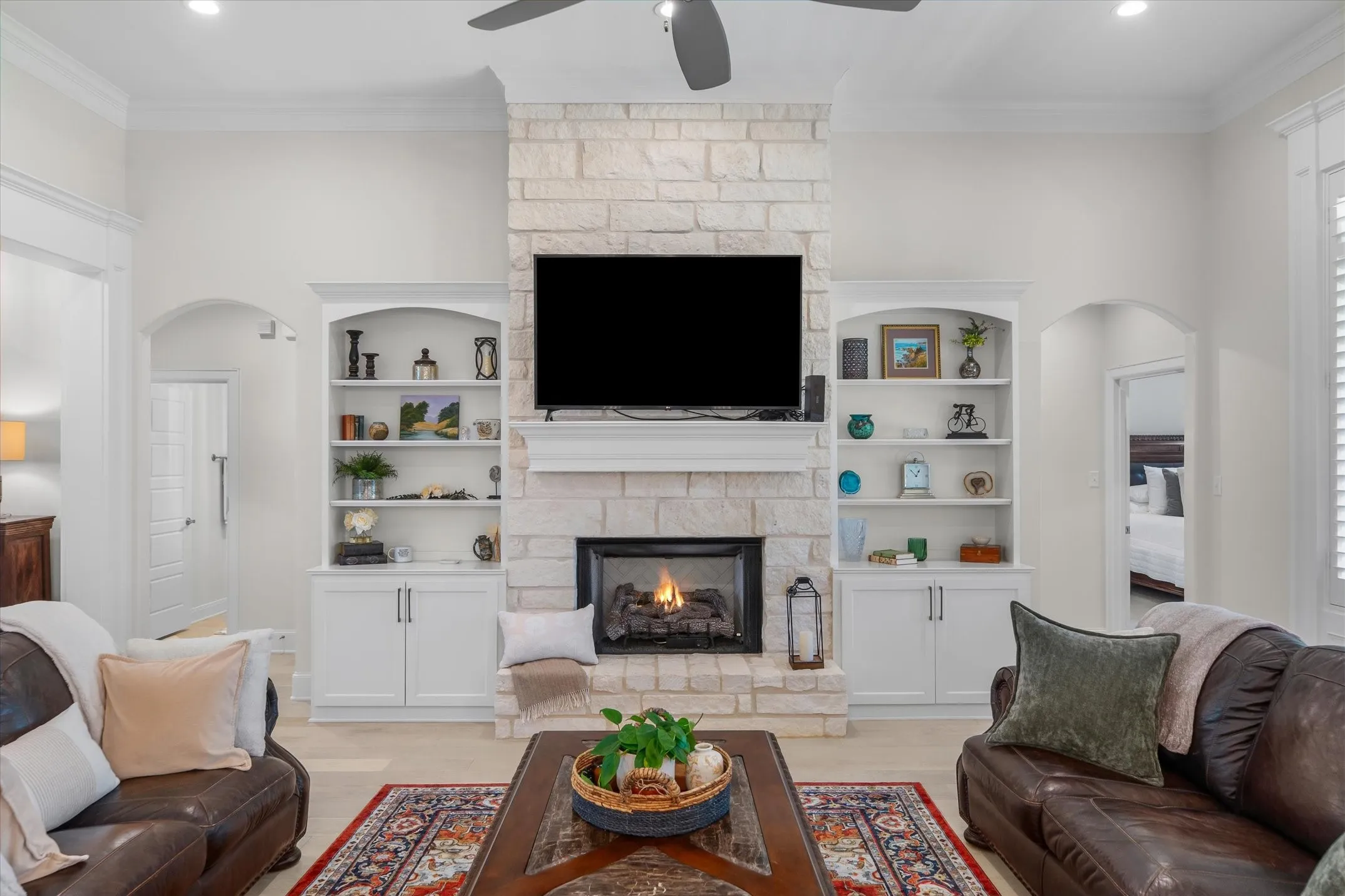Well loved built-ins surround the Austin stone fireplace making this a great family space