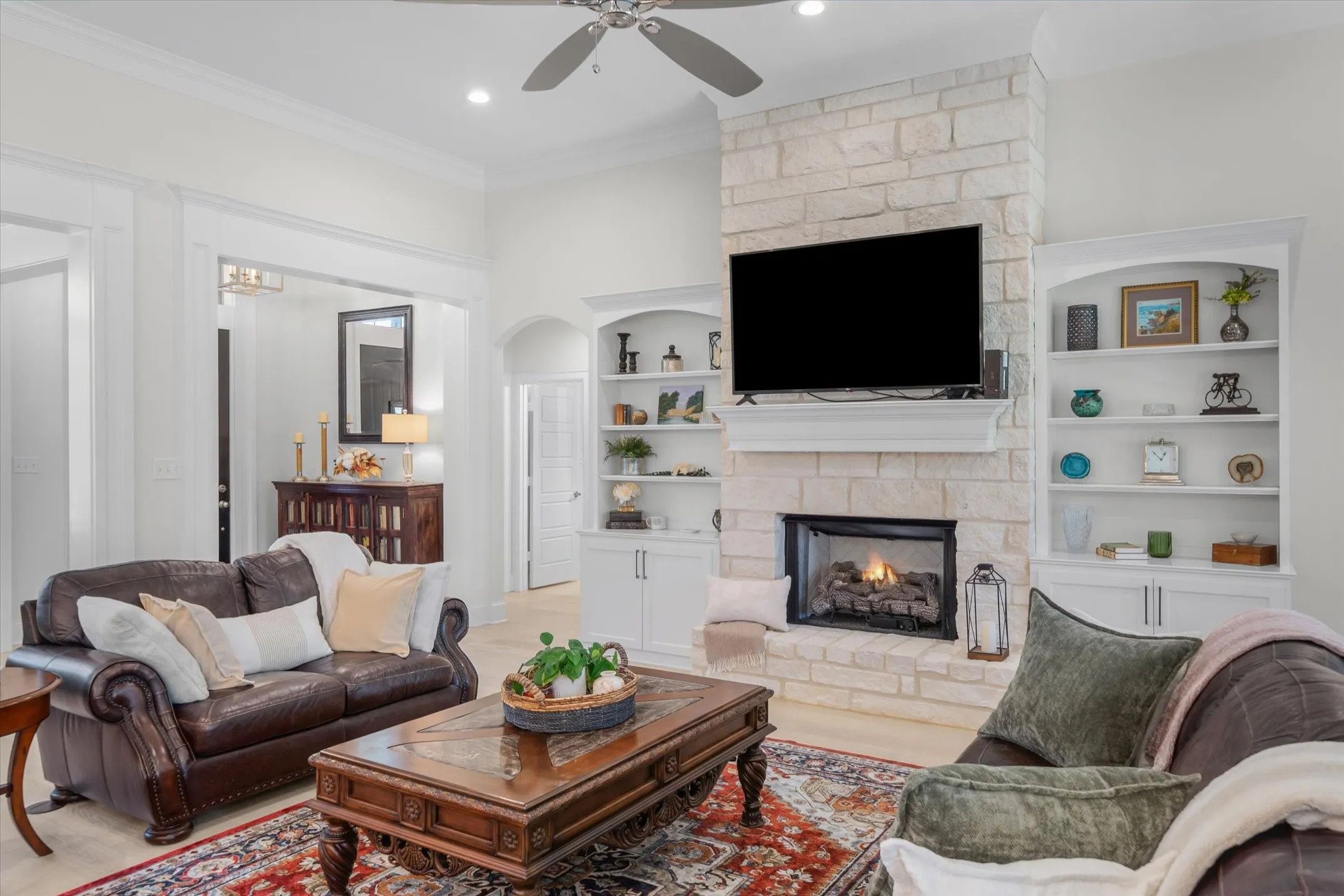 Floor to ceiling Austin stone gas fireplace