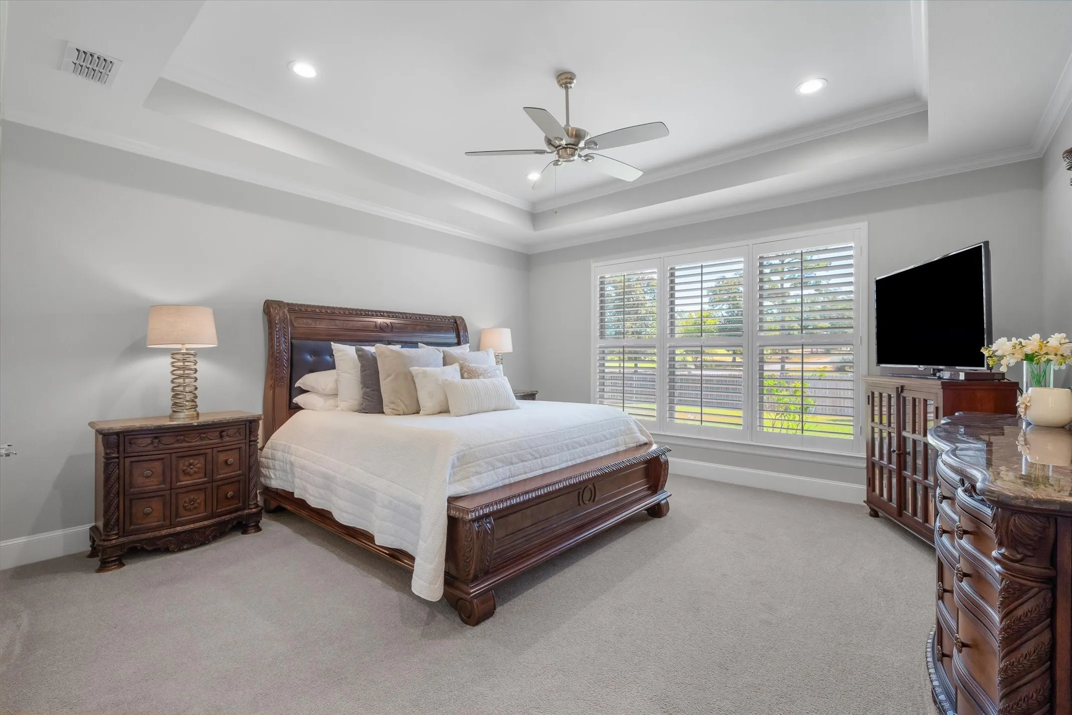 This huge master suite is very warm and welcoming with nice views and tray ceilings