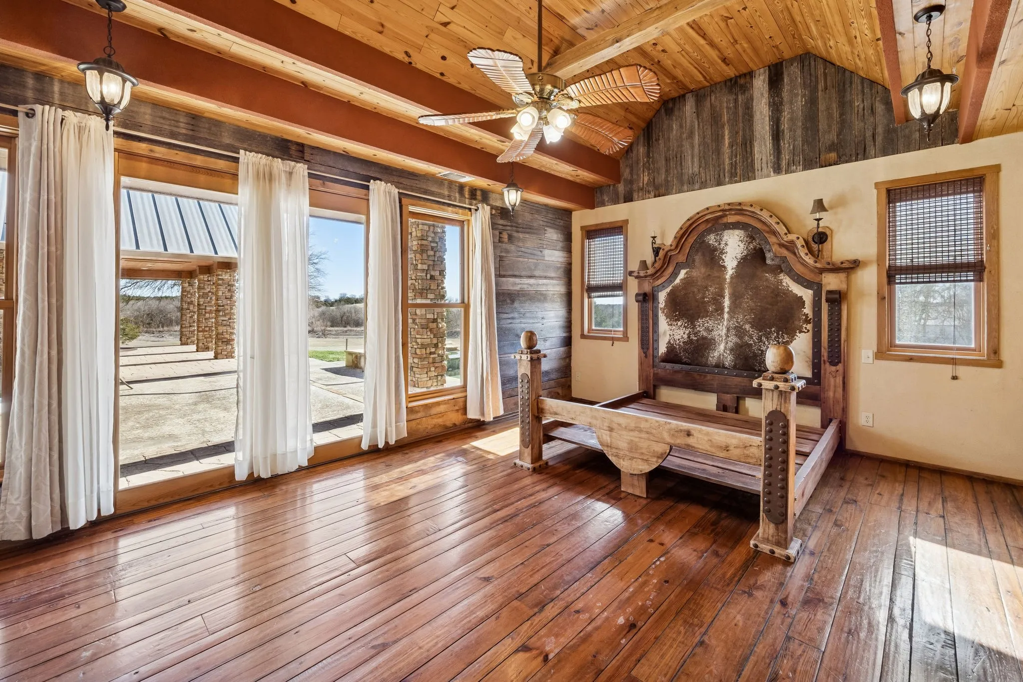 Vaulted wood-paneled ceiling with exposed beams