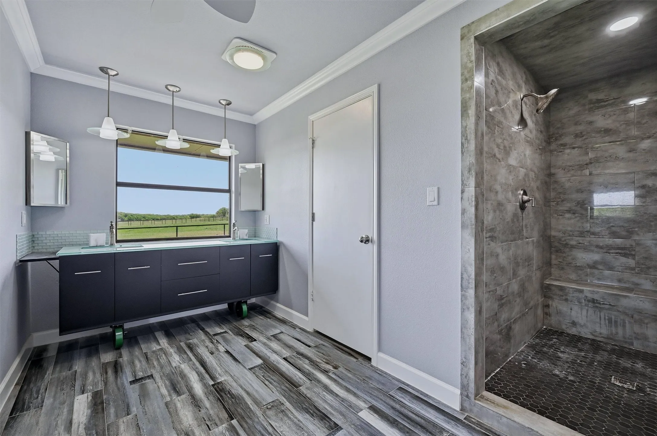 This bathroom has a large vanity and a stand-alone shower.