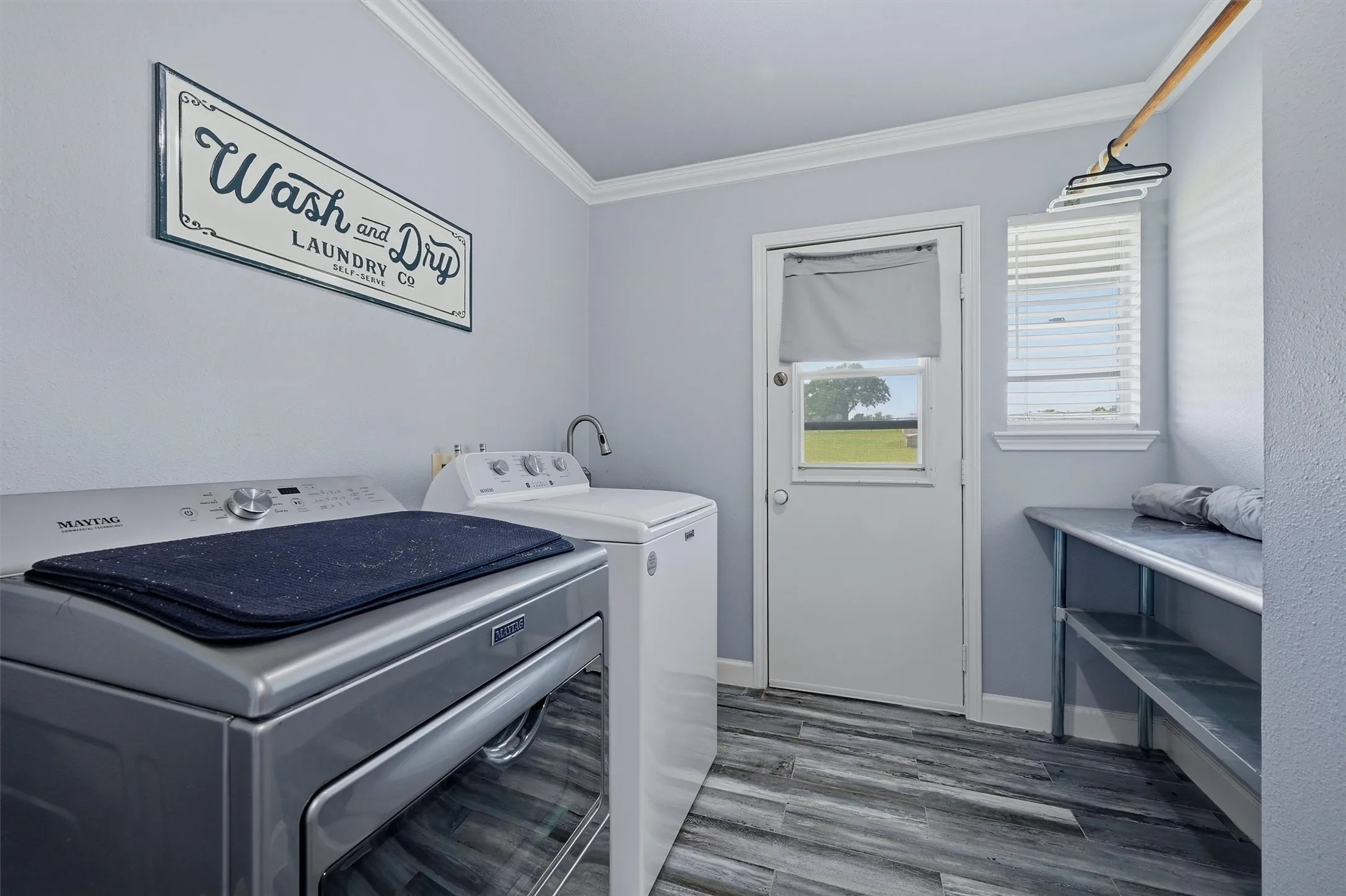 Spacious laundry room with direct access to the outdoors.