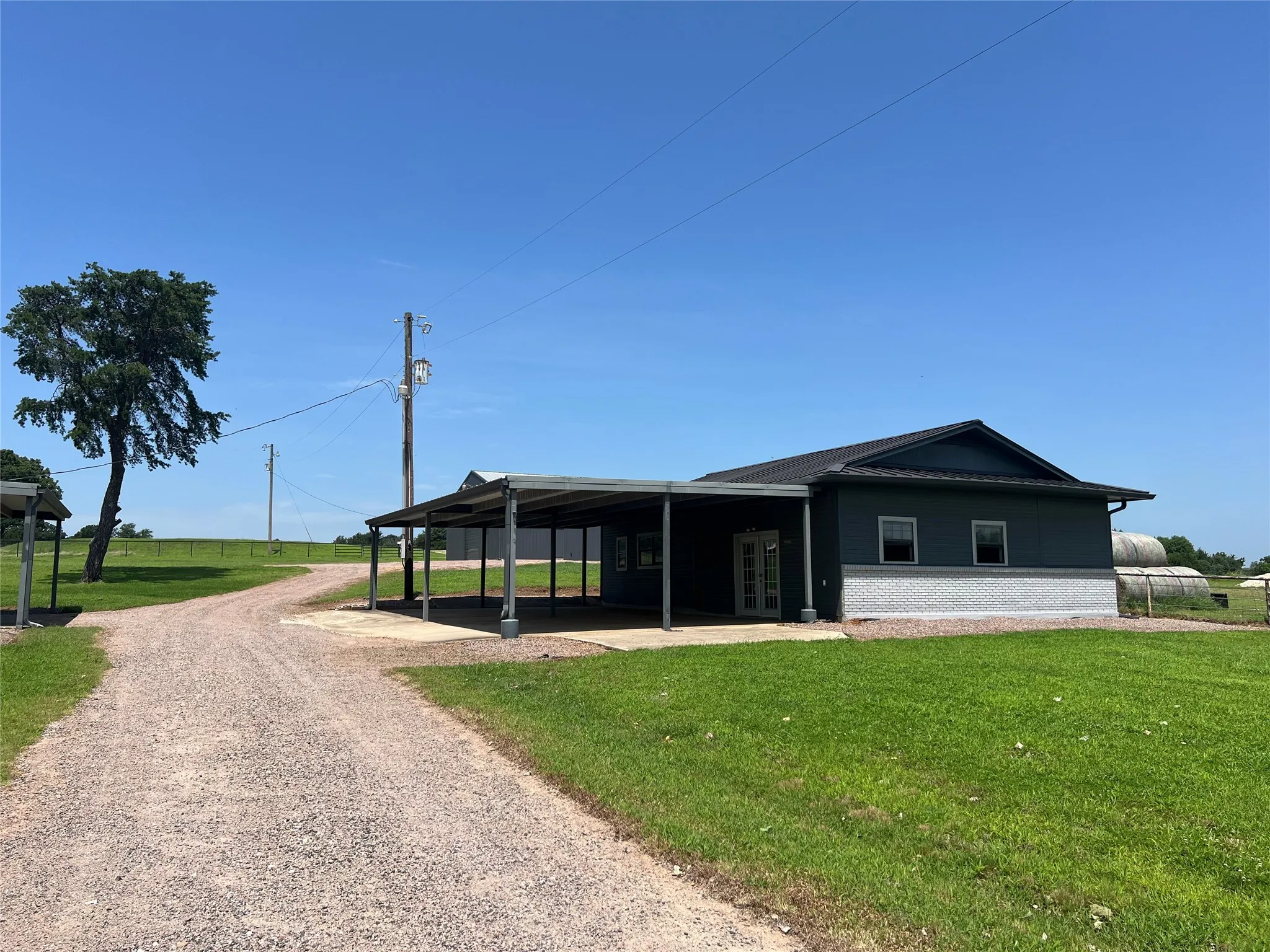 Adjacent tool shed-garage provides covered parking, an office-party space and a workshop space.  Could be converted to a guest house or apartment.