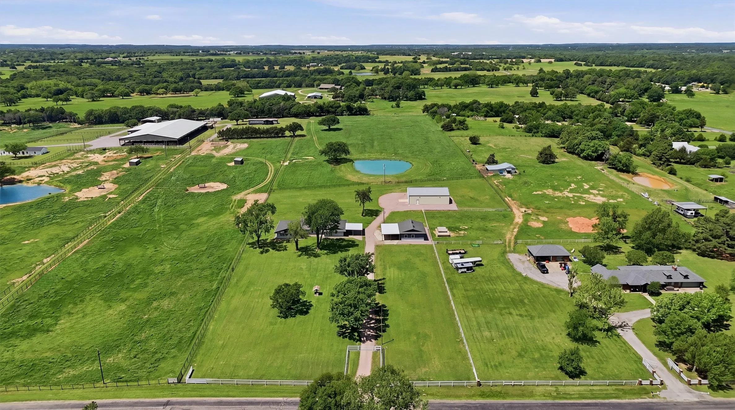 Aerial view from Roland Road - property includes pond and pasture behind it.