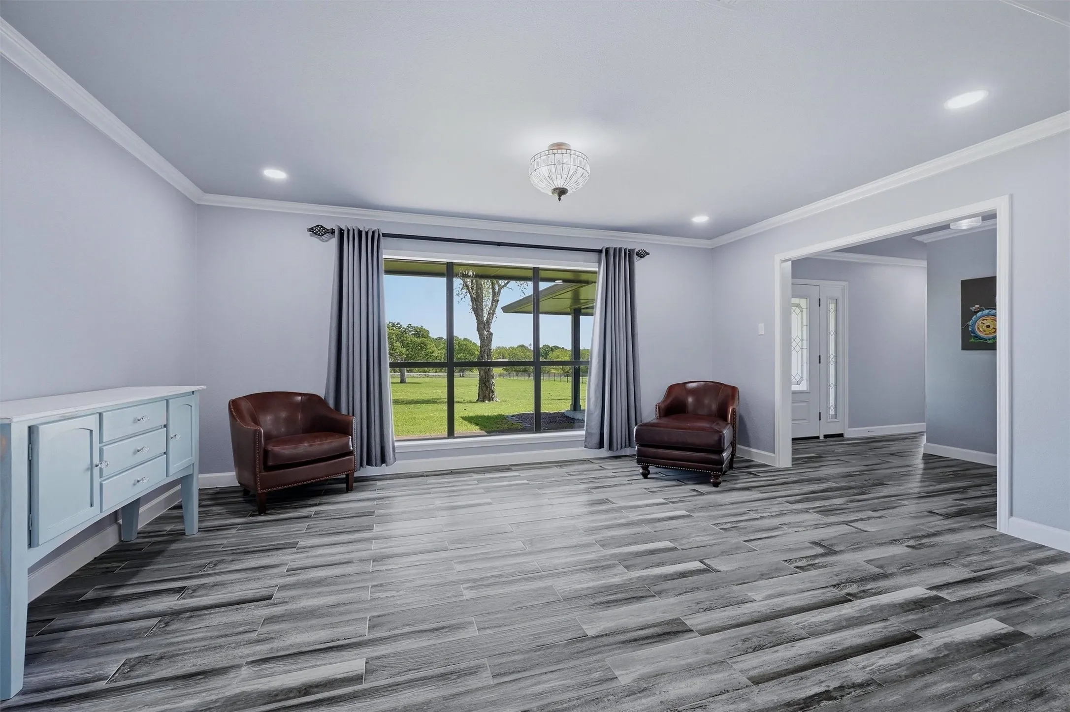 Sitting room area just inside the main entrance has potential for multipole uses.