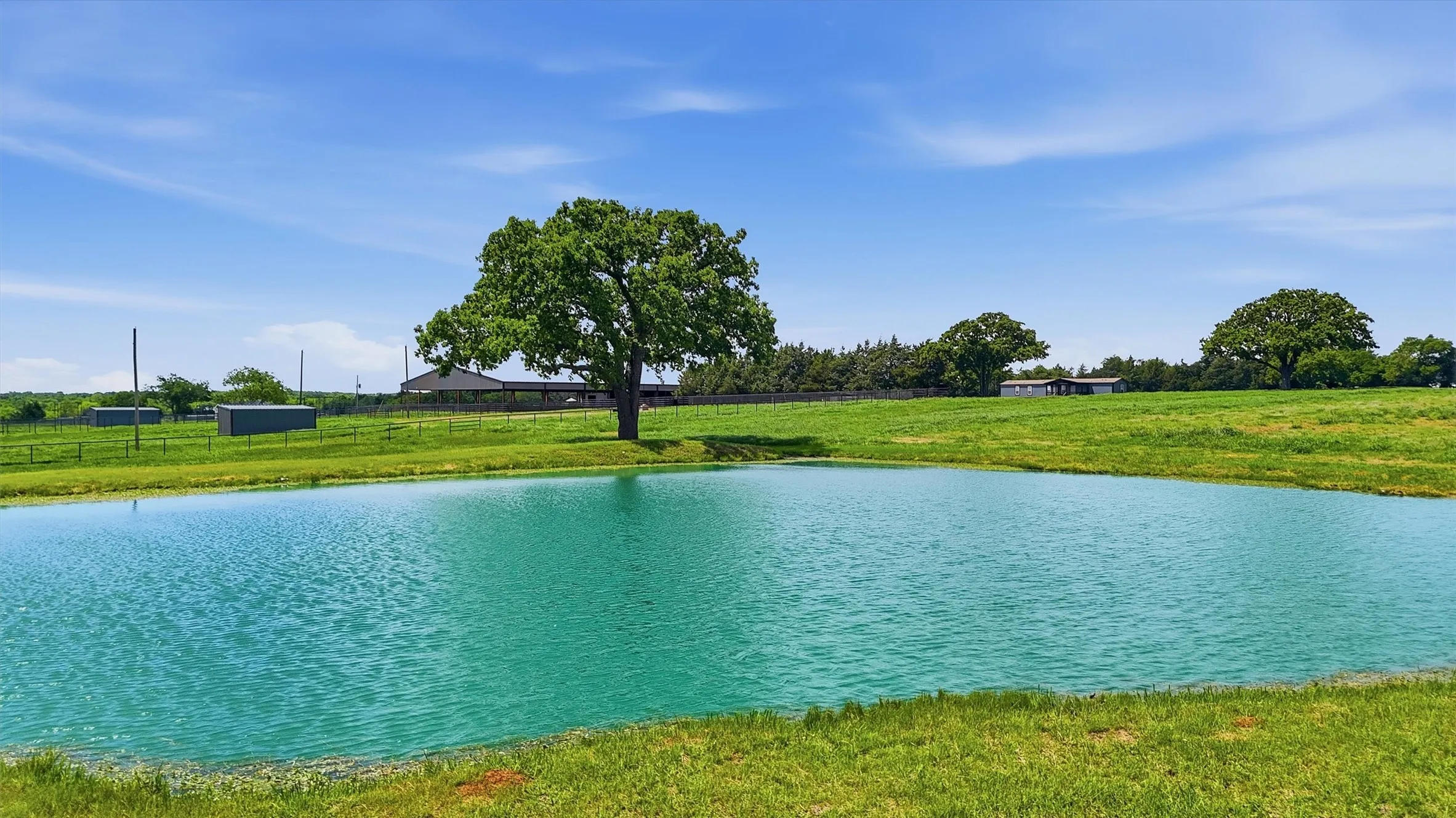 Well maintained, beautiful pond in back pasture is perfect for your livestock - or maybe fishing!