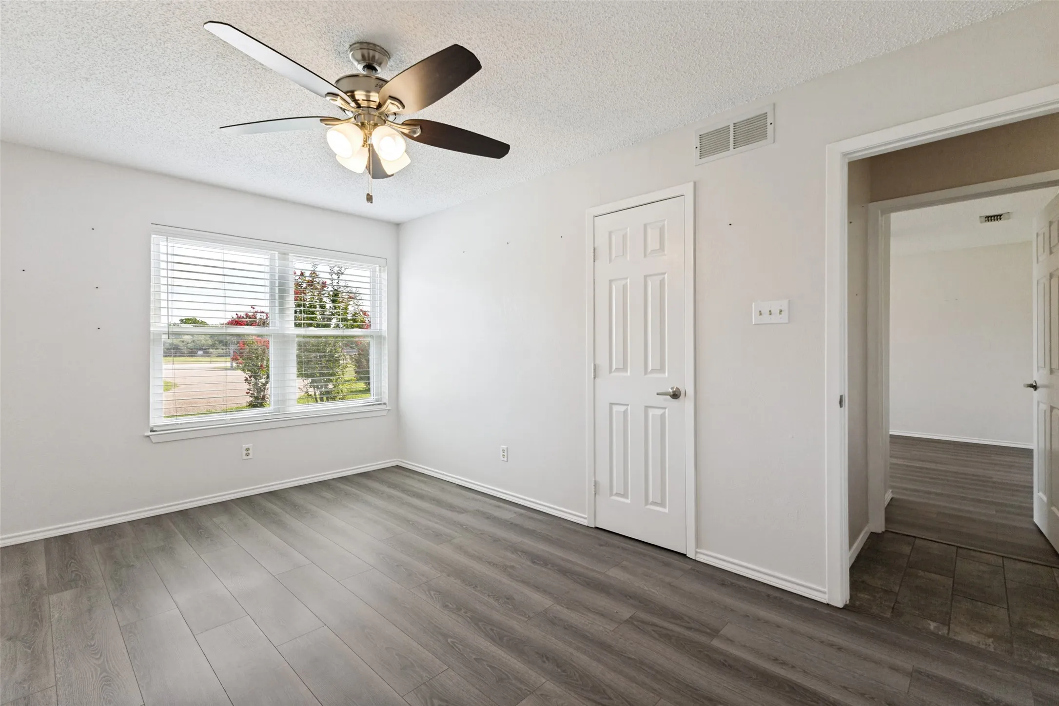 Spacious bedroom with LVP flooring