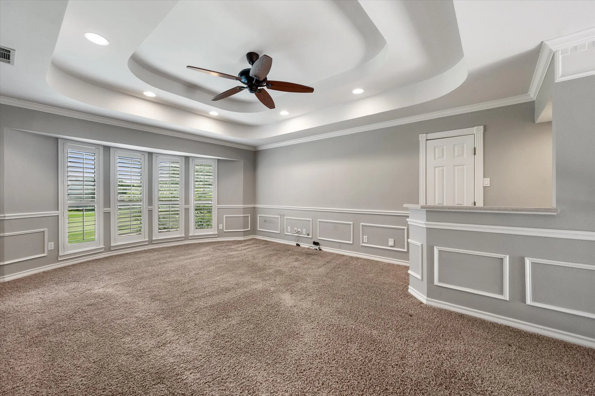 Upstairs game room with a wet bar and access to floored attic space for easy storage.