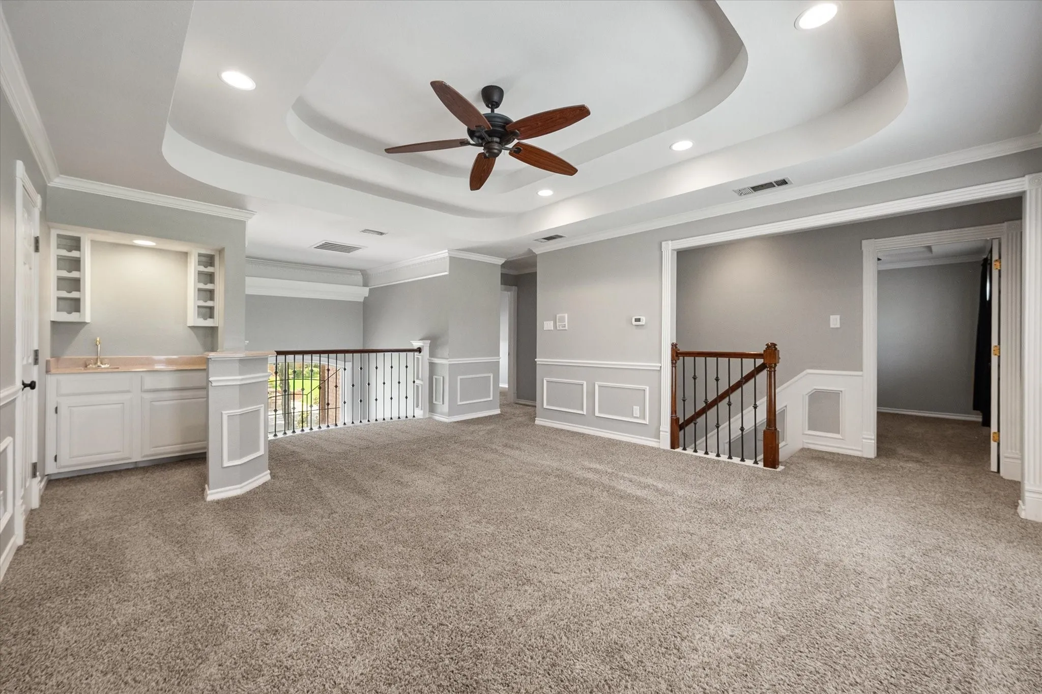 Upstairs game room with a wet bar