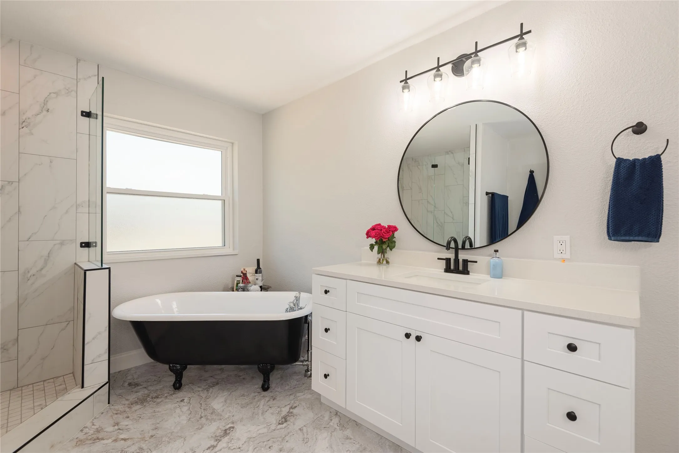 Large separate shower and claw foot tub