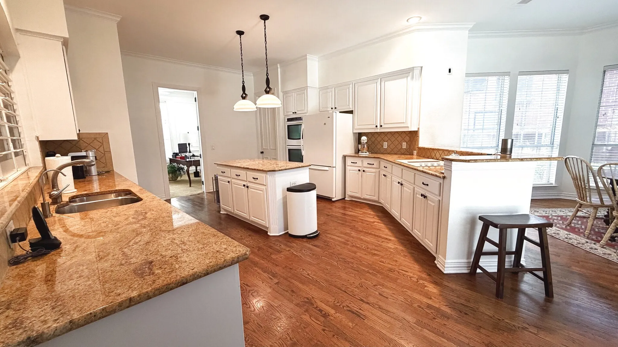 Spacious kitchen with kitchen island and dining area