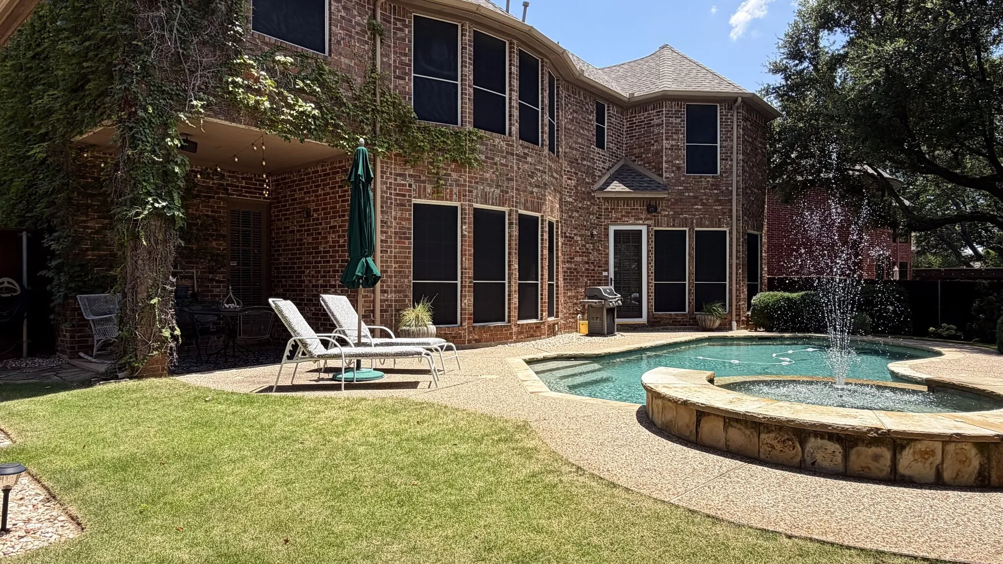 Beautifully landscaped backyard. Large yard with pool and mature landscape.