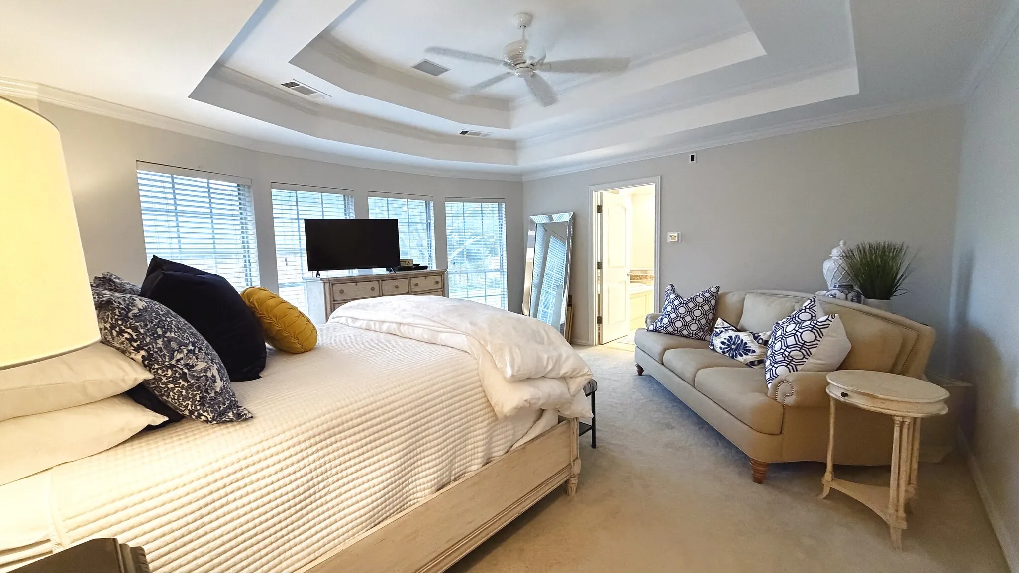spacious primary bedroom with beautiful, tall ceilings