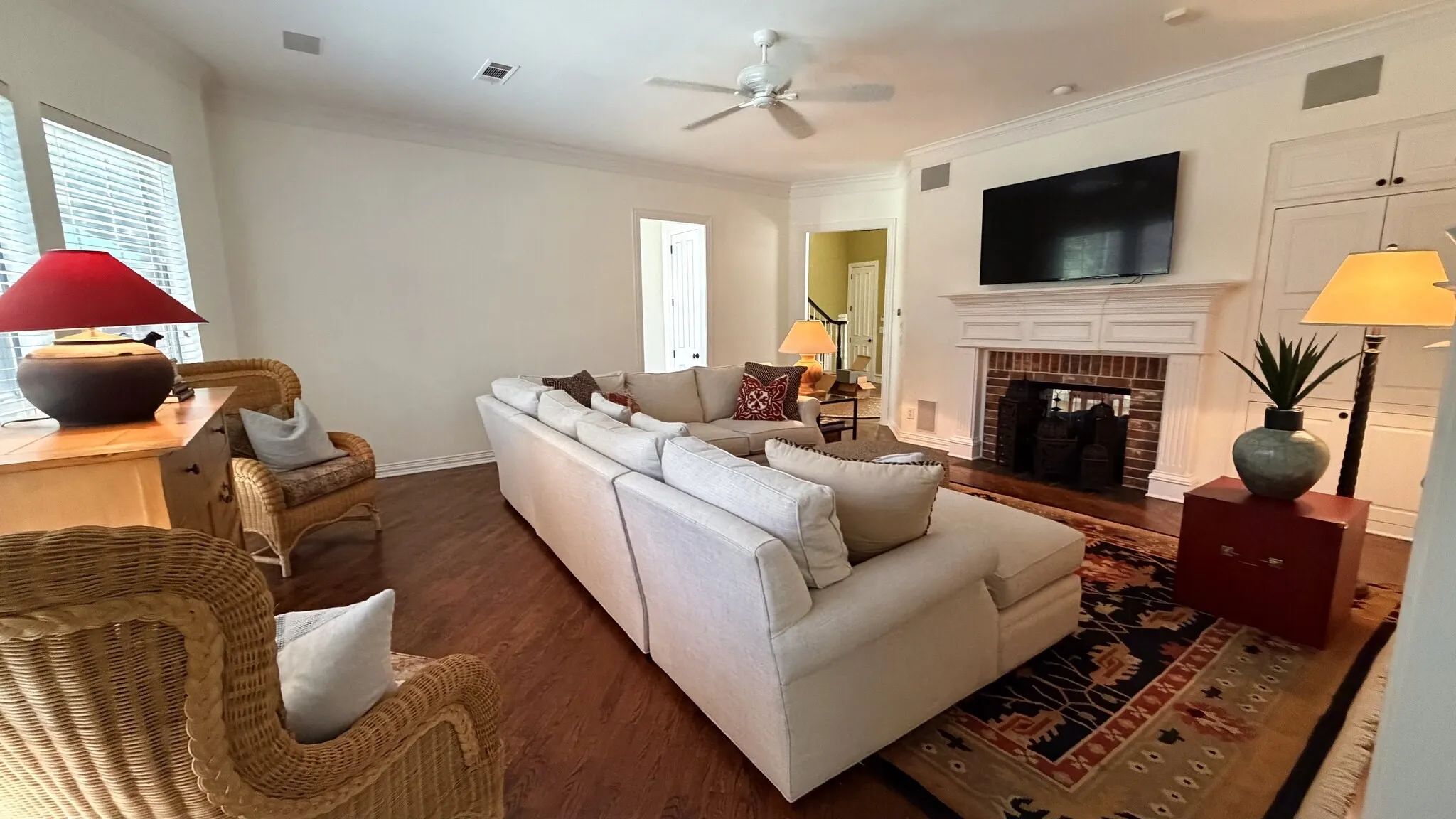 Family or living room, great for entertaining and relaxing, has the built in fireplace and cabinets