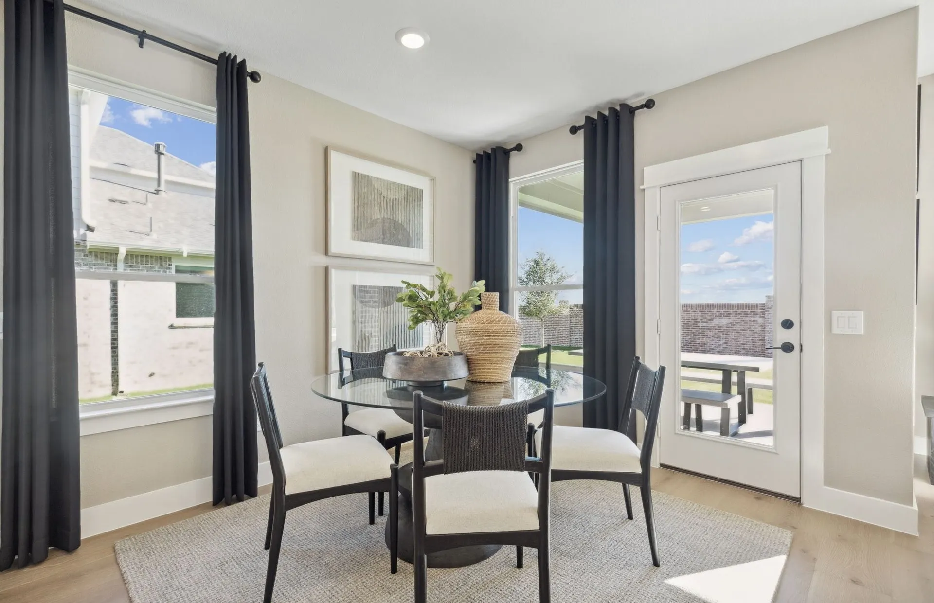 *Model Representation - Dining area off kitchen with large windows