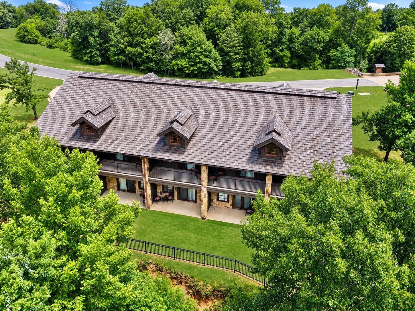 Wood shingle roof with three dormer windows