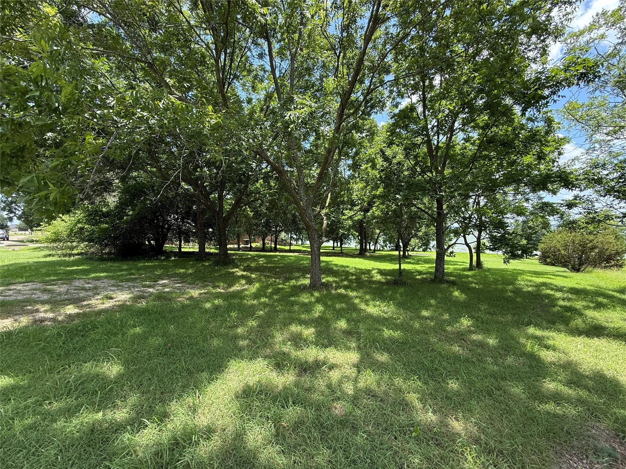 Expansive lakefront grounds provide multiple possibilities for a custom home design.