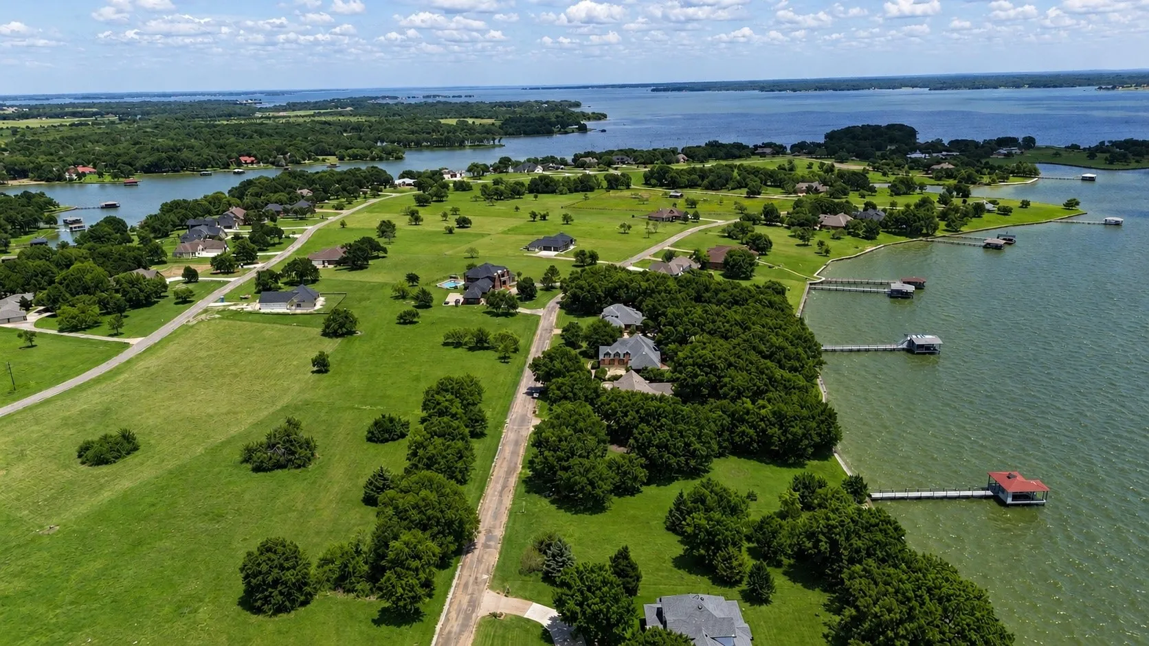 Aerial perspective highlighting the waterfront location and expansive setting within gated Arrowhead.