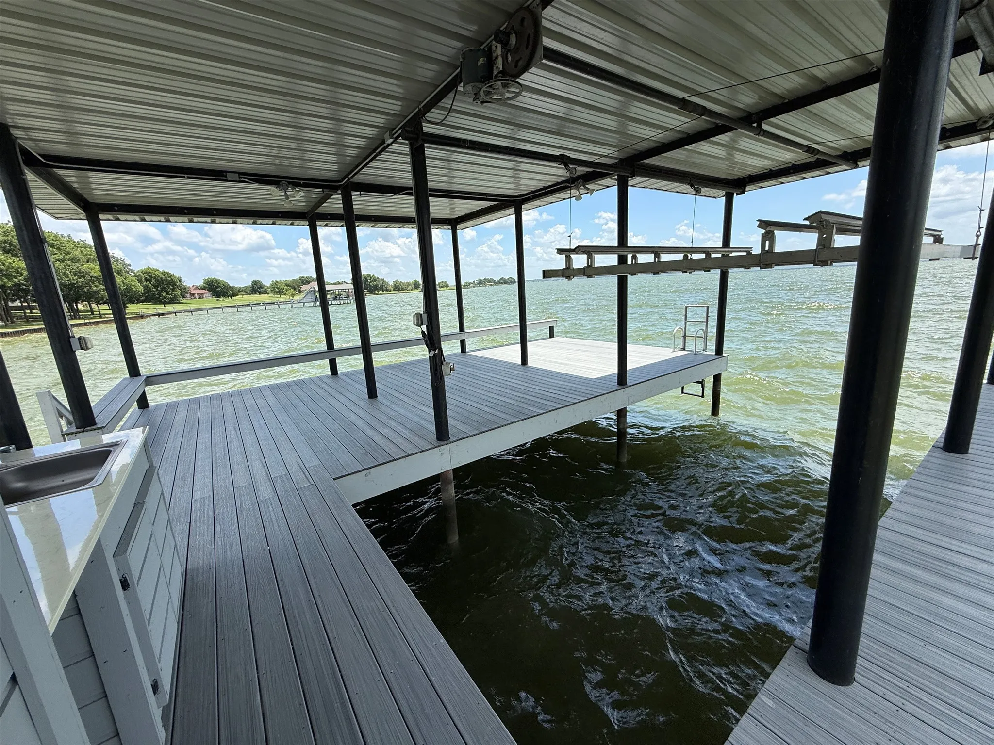 Integrated boat lift system helps keep your watercraft protected and ready for lake adventures.