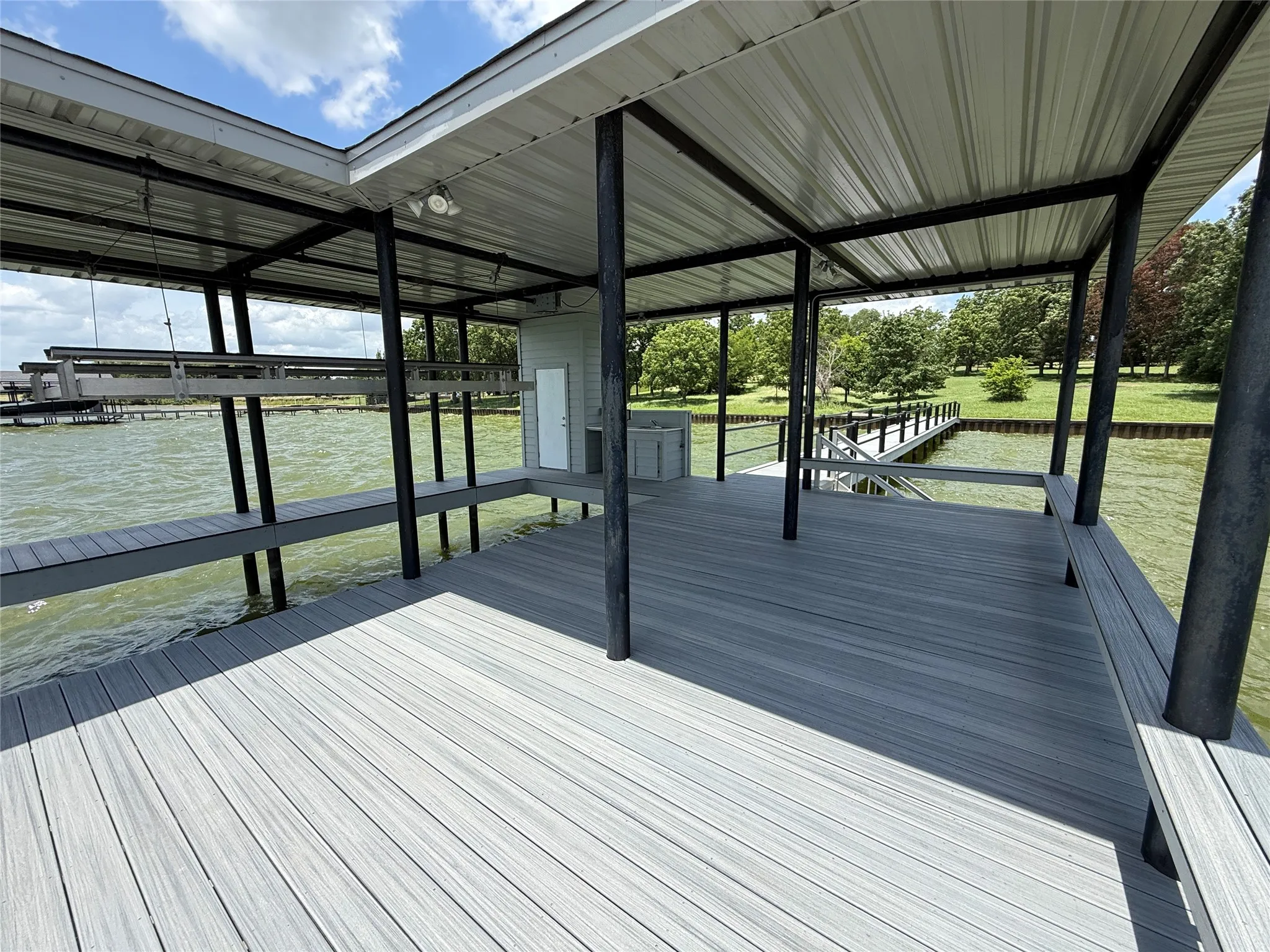 Enjoy panoramic lake views from this impressive boathouse designed for waterfront living.