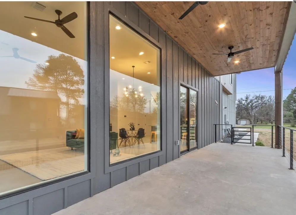 Covered outdoor patio featuring a wood-finish ceiling, recessed lighting, and dual ceiling fans