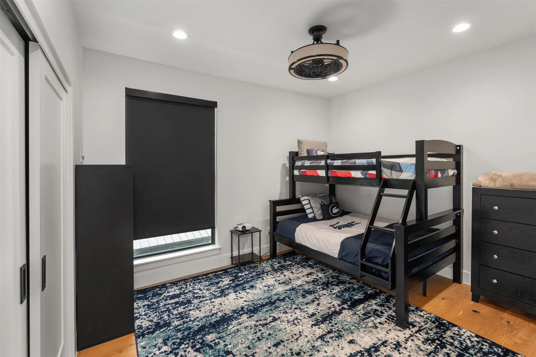 Bright room featuring light wood flooring and neutral wall tones