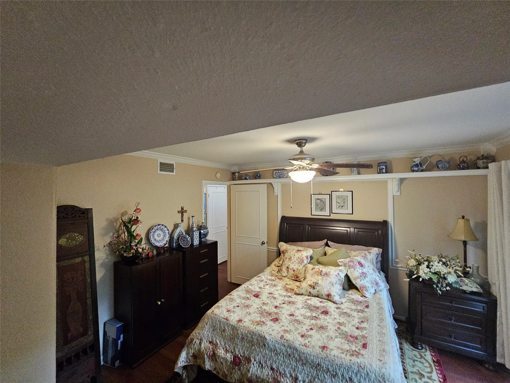 Bedroom featuring a top shelf around room