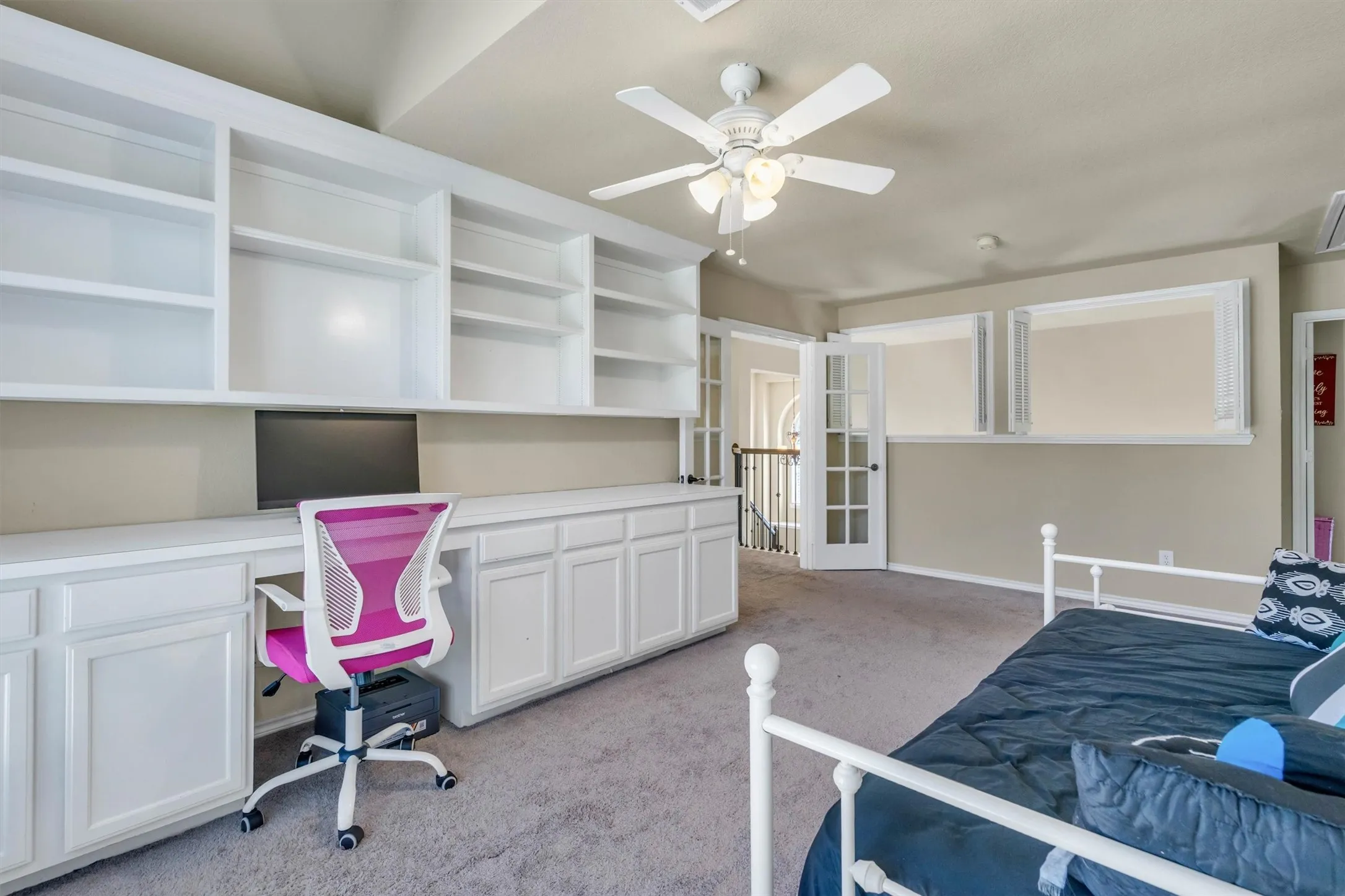 This room splits the bedrooms upstairs.  Owner's Retreat is to the left of the double French doors. Notice the shutters can be closed for noise control!