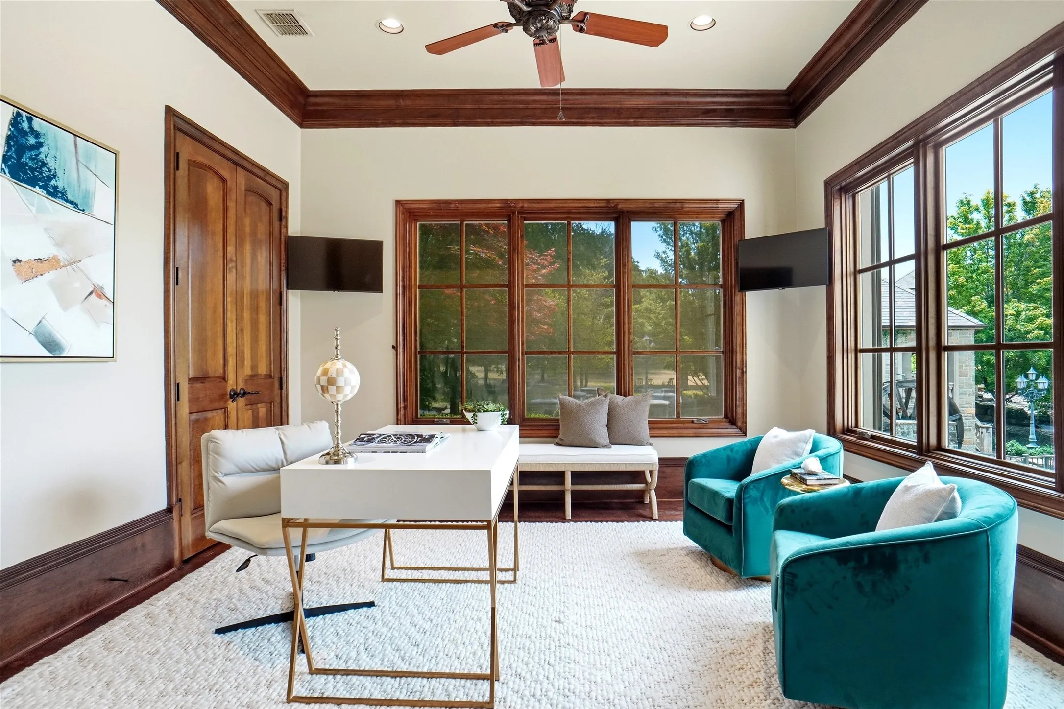 Currently used as a second office - but could also be a 7th bedroom- featuring rich wood-stained trim and double doors.
