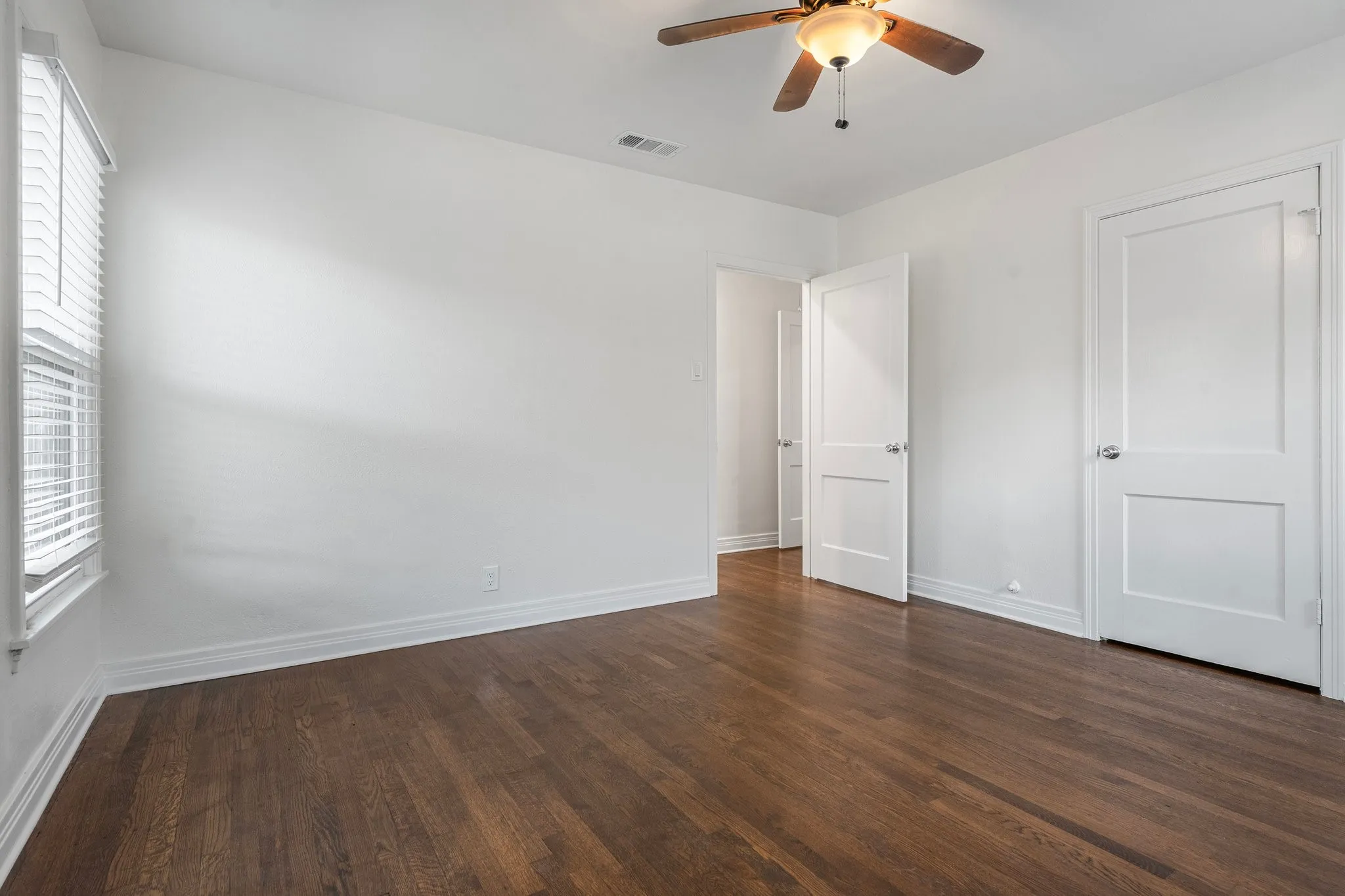 Bedroom With Lots Of Light And Views Of Back Yard.