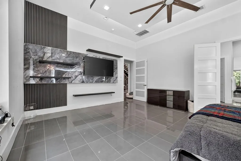 Feature wall with dark vertical slat paneling and a large, veined stone-finish accent