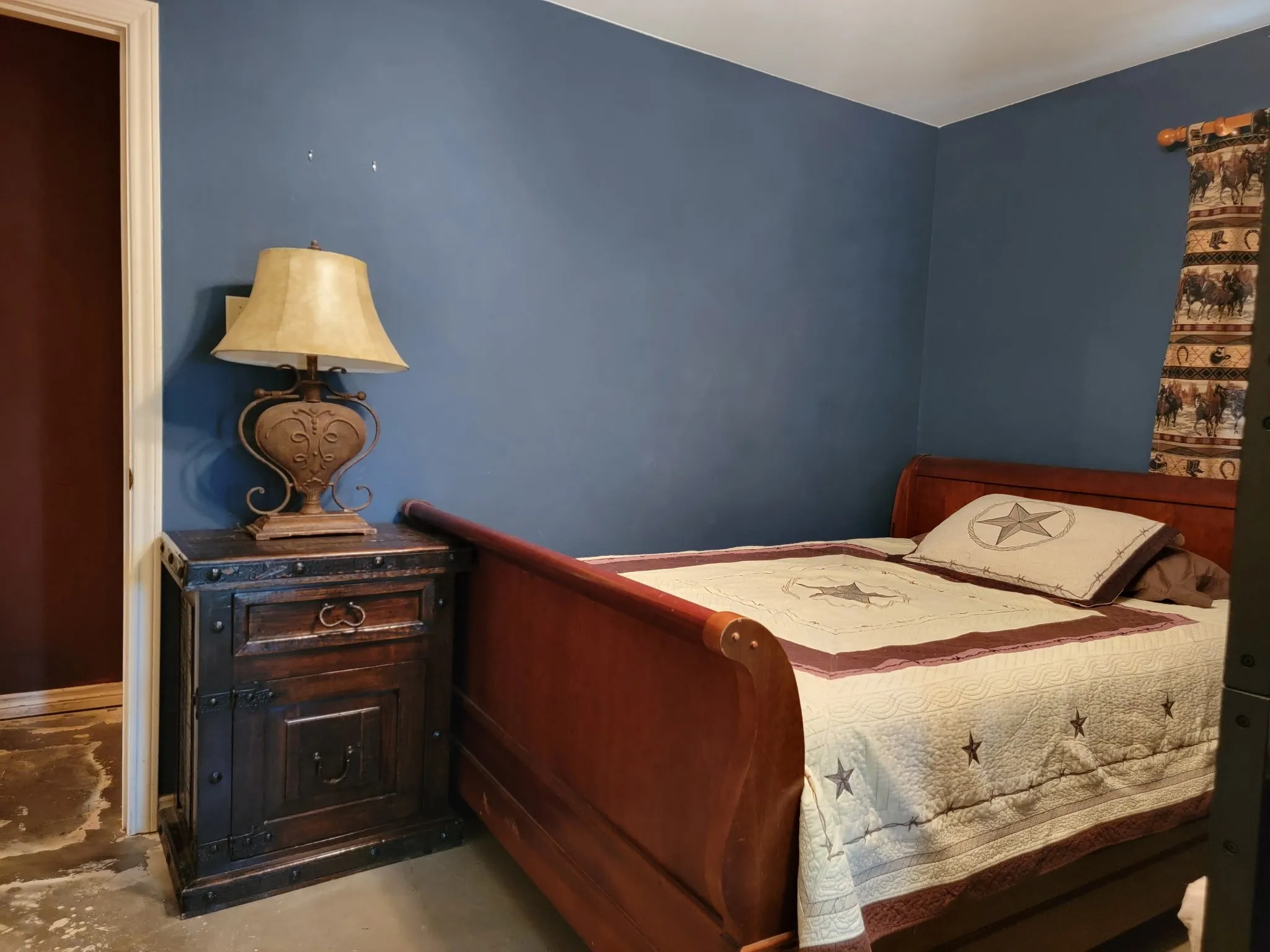 Deep blue wall with white trim and a contrasting deep red accent wall